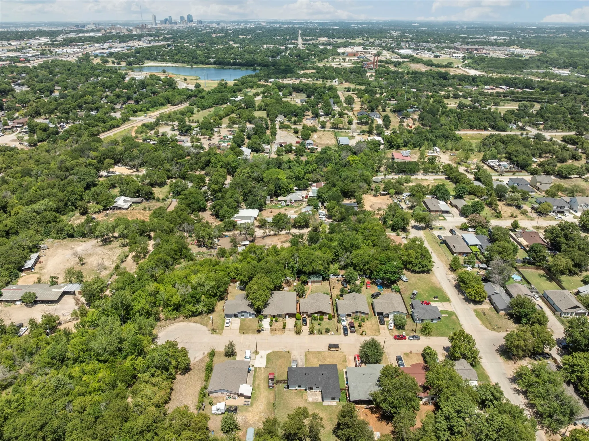 Aerial view of residential area featuring a nearby body of water