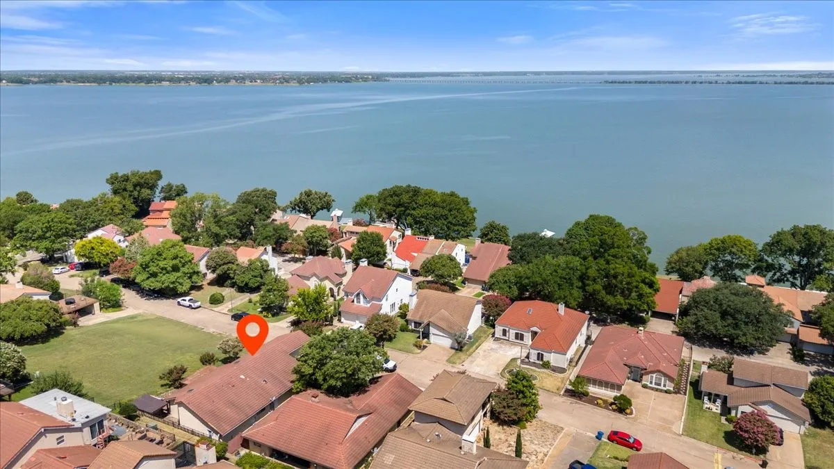 Aerial view of residential area with a large body of water