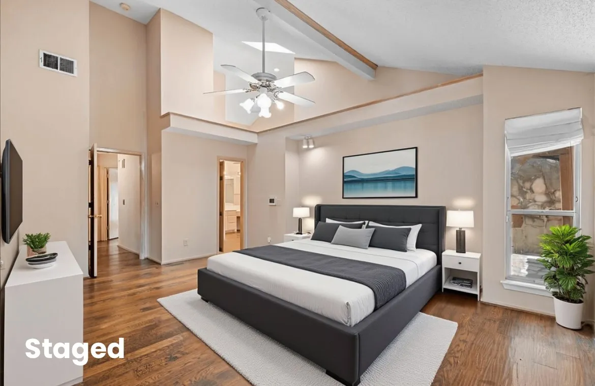 Bedroom with beamed ceiling, wood finished floors, ceiling fan, high vaulted ceiling, and ensuite bath