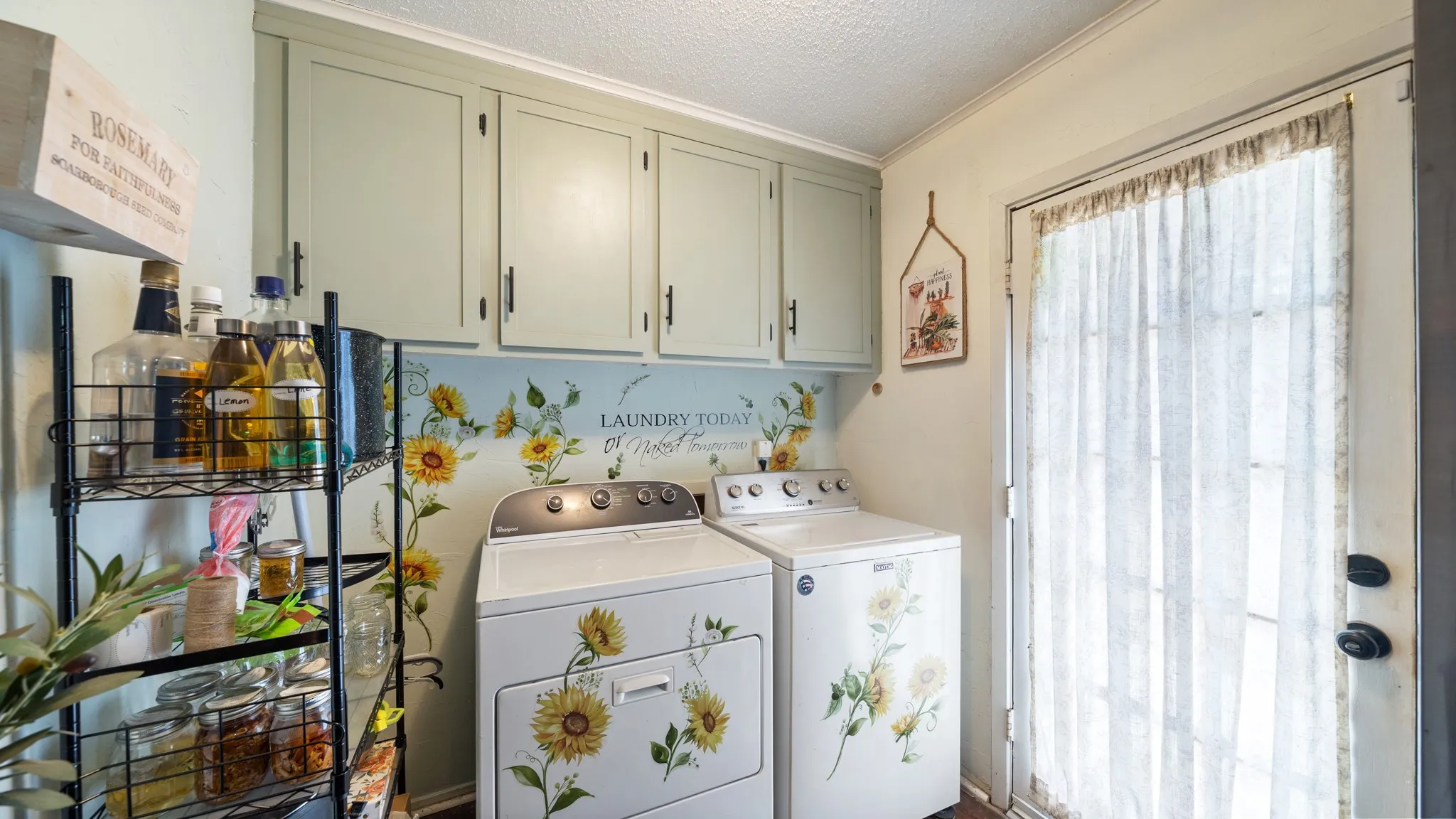 Built-in cabinetry with dark hardware and a full-light exterior door