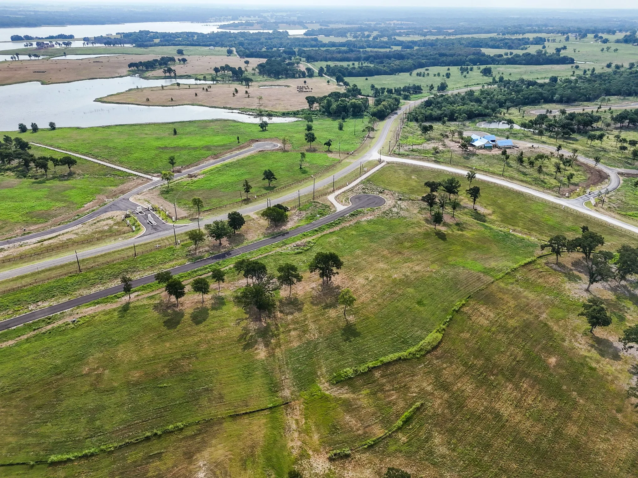 View of property location with a nearby body of water and rural landscape