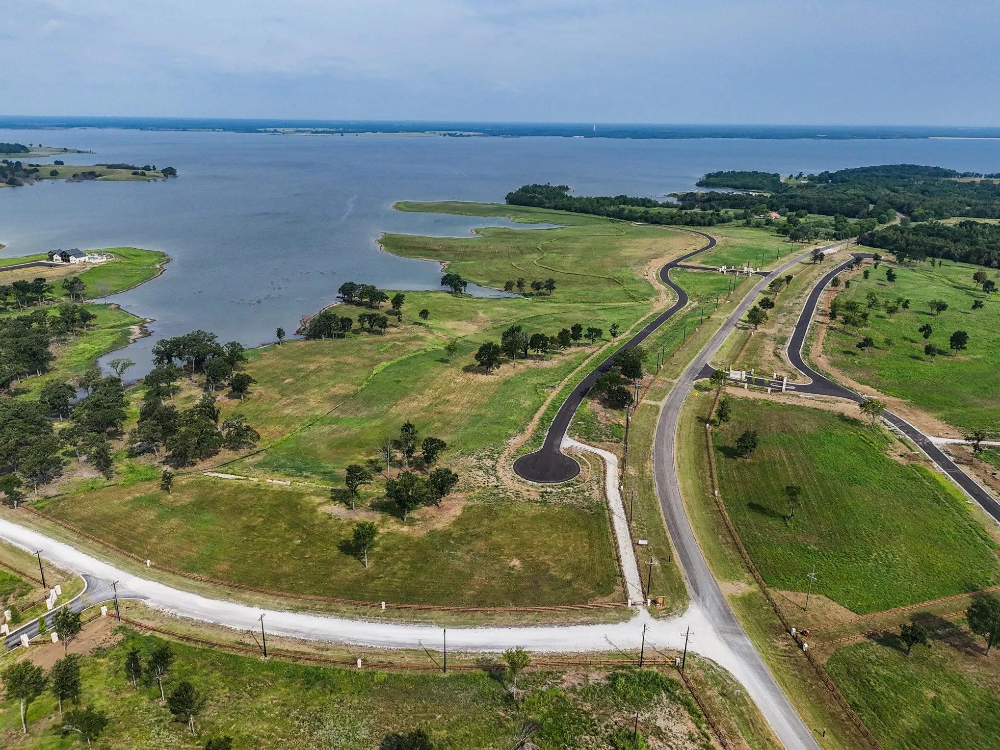 Aerial overview of property's location featuring a large body of water
