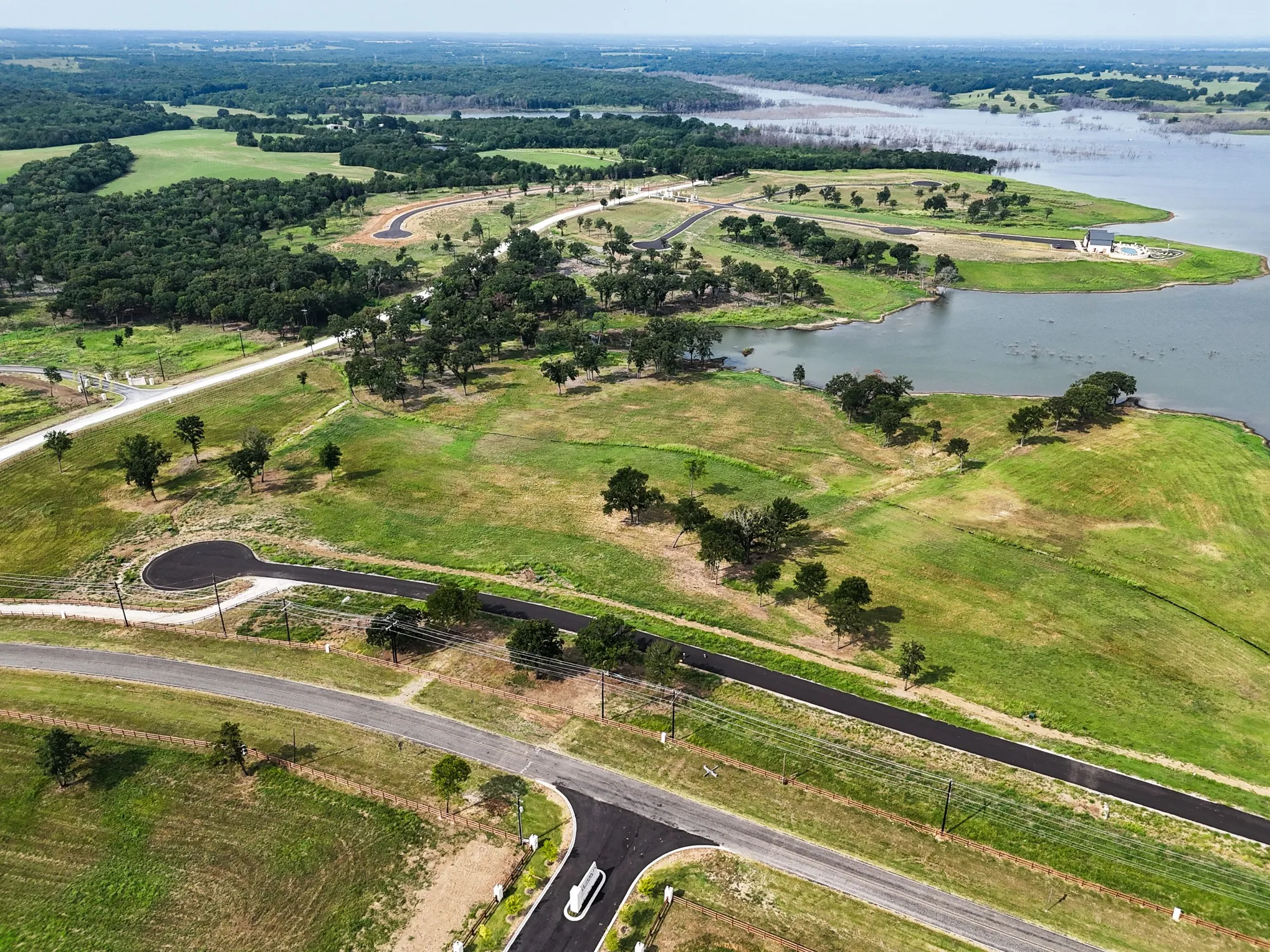 Aerial view of property's location featuring a nearby body of water