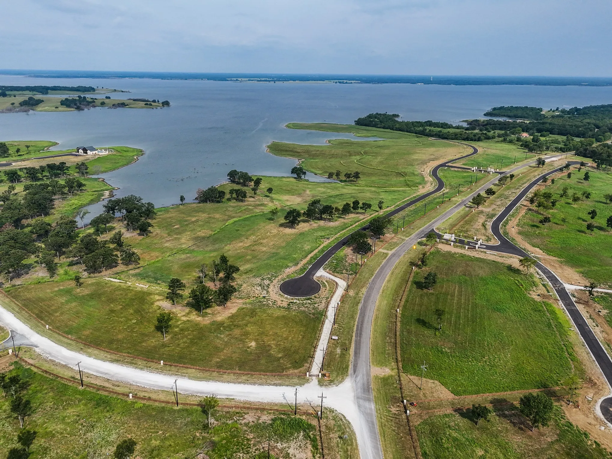 Aerial overview of property's location featuring a large body of water