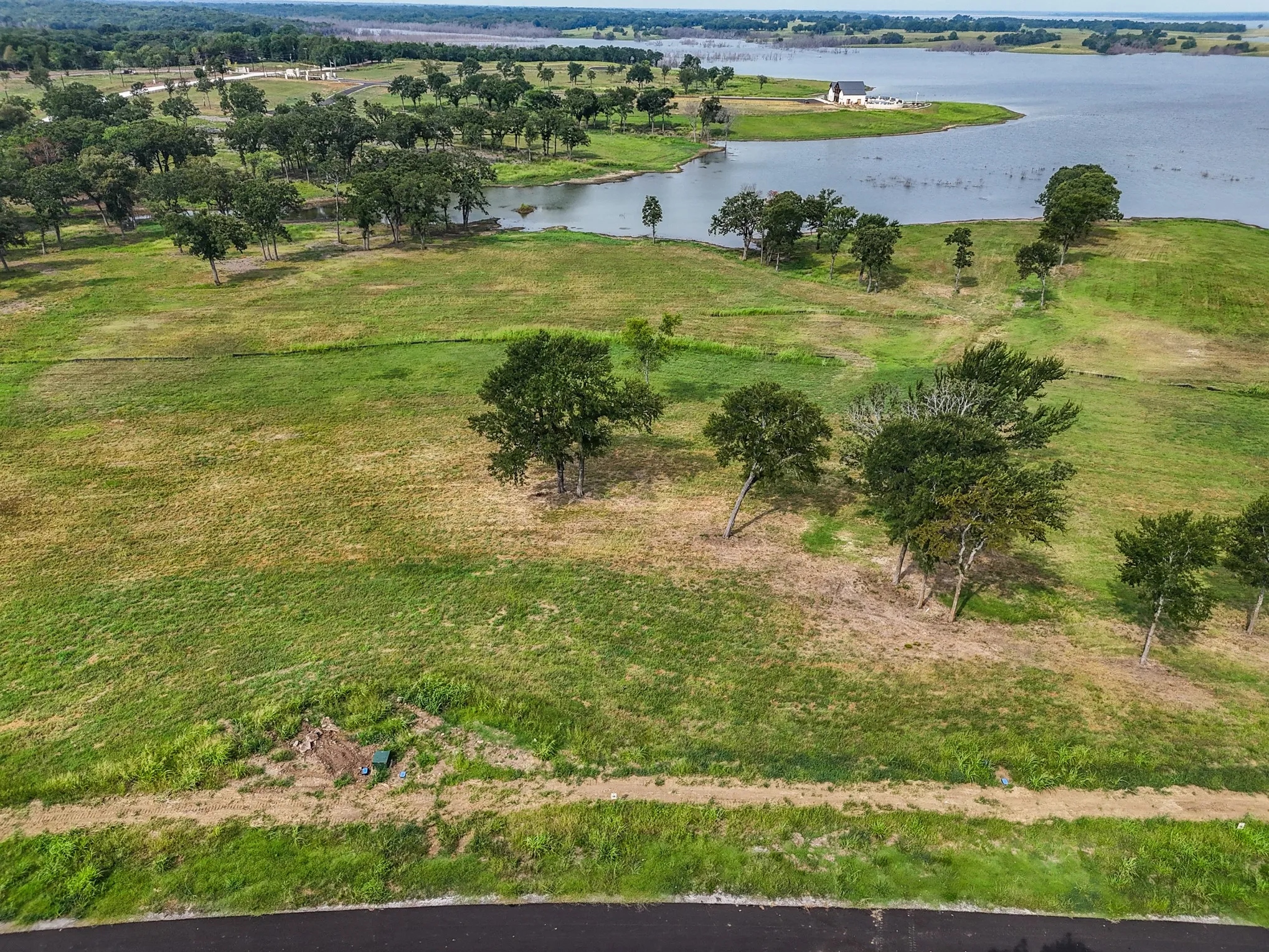 Aerial overview of property's location featuring a nearby body of water