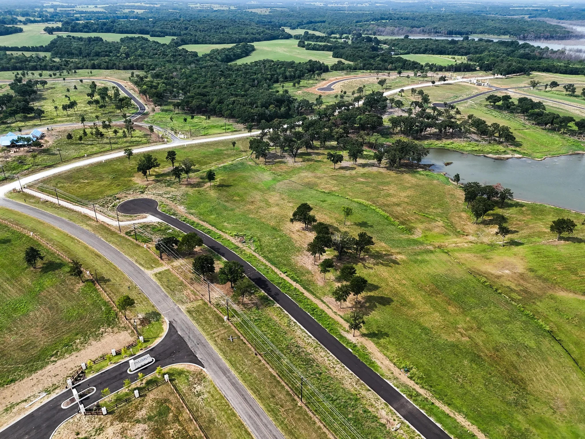 Aerial overview of property's location with a nearby body of water
