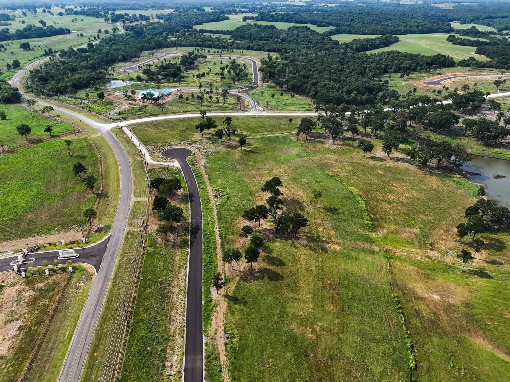 Aerial view of property's location with a nearby body of water