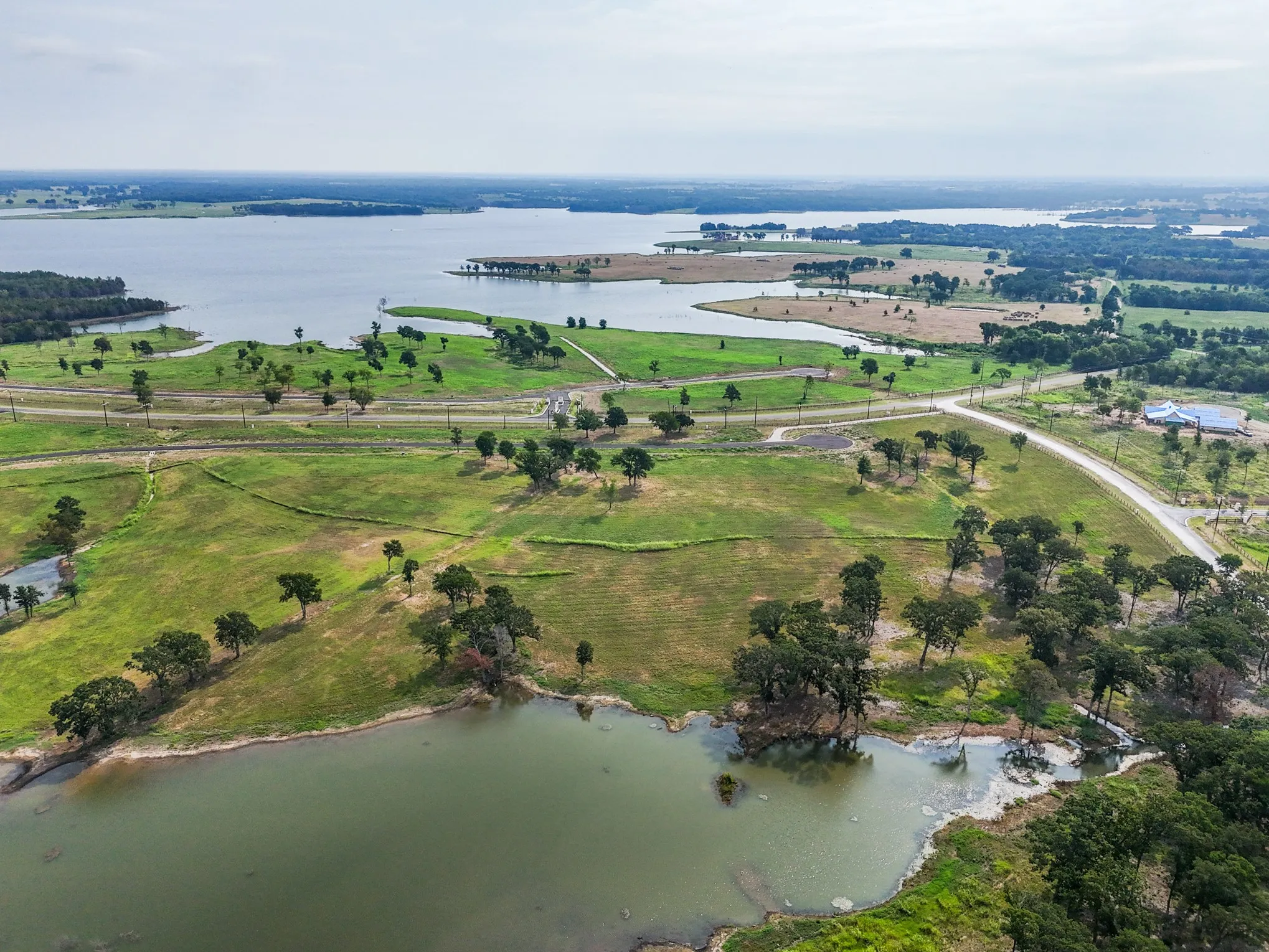 Aerial view of property's location with a nearby body of water