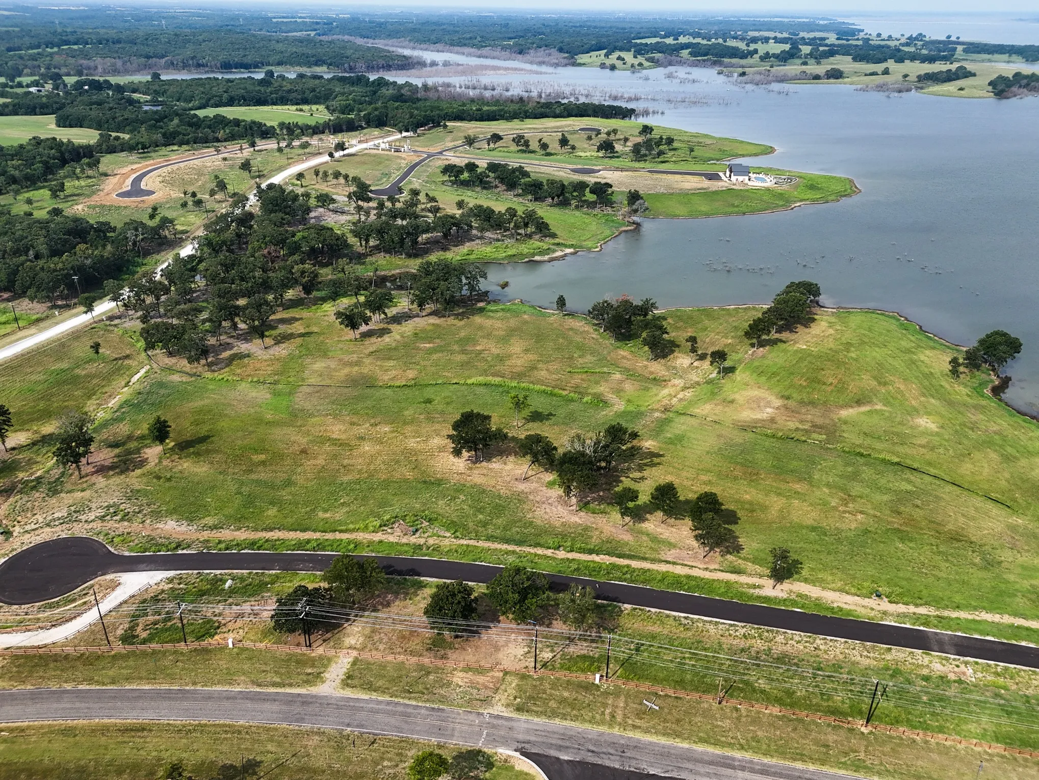 Aerial view of property's location featuring a nearby body of water
