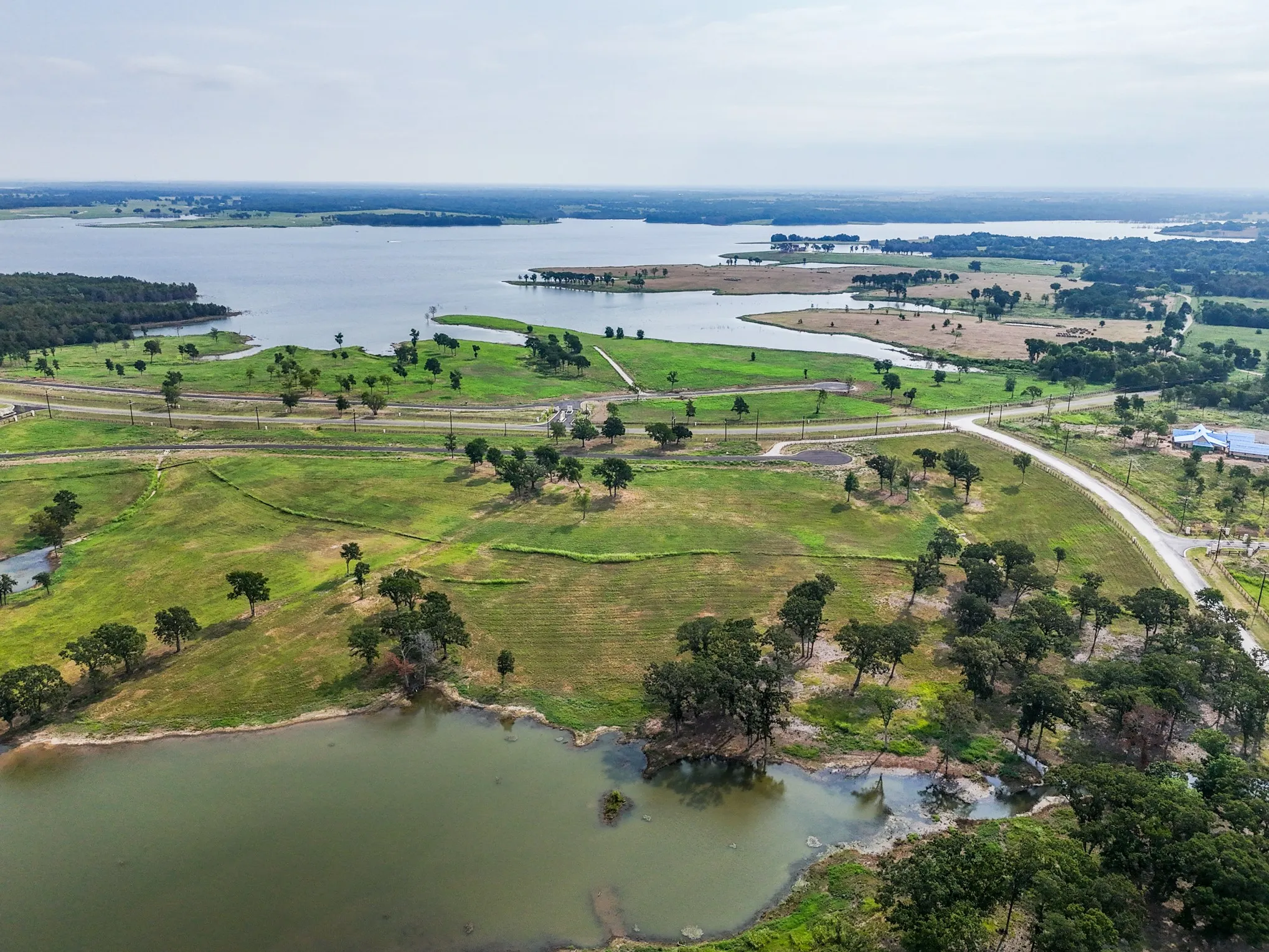 Aerial overview of property's location with a large body of water