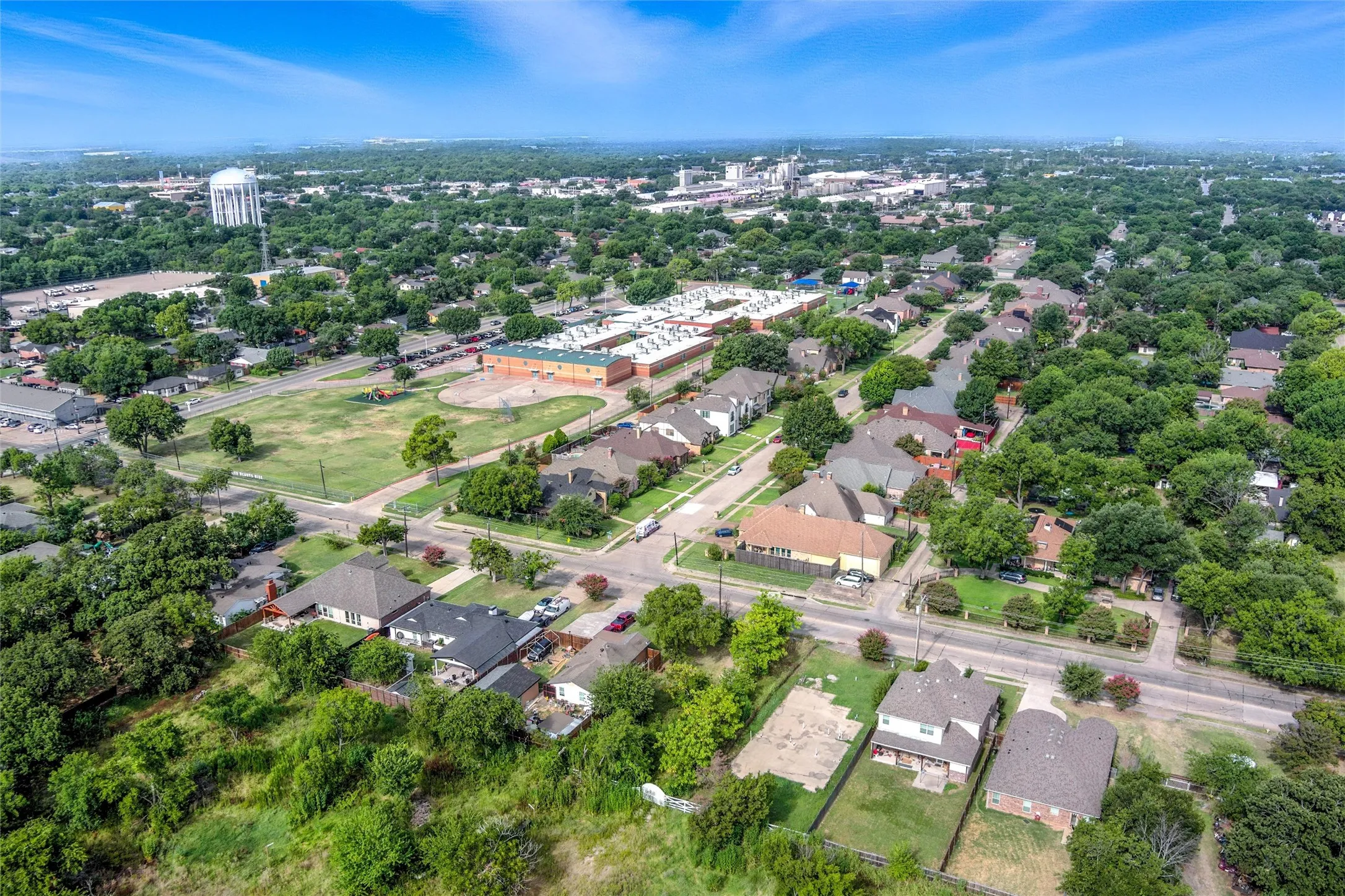 Aerial overview of property's location featuring nearby suburban area