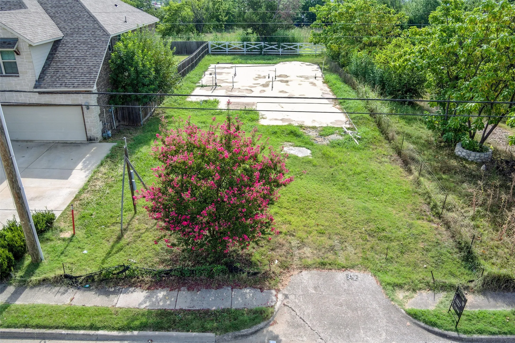 View of yard with driveway and a garage