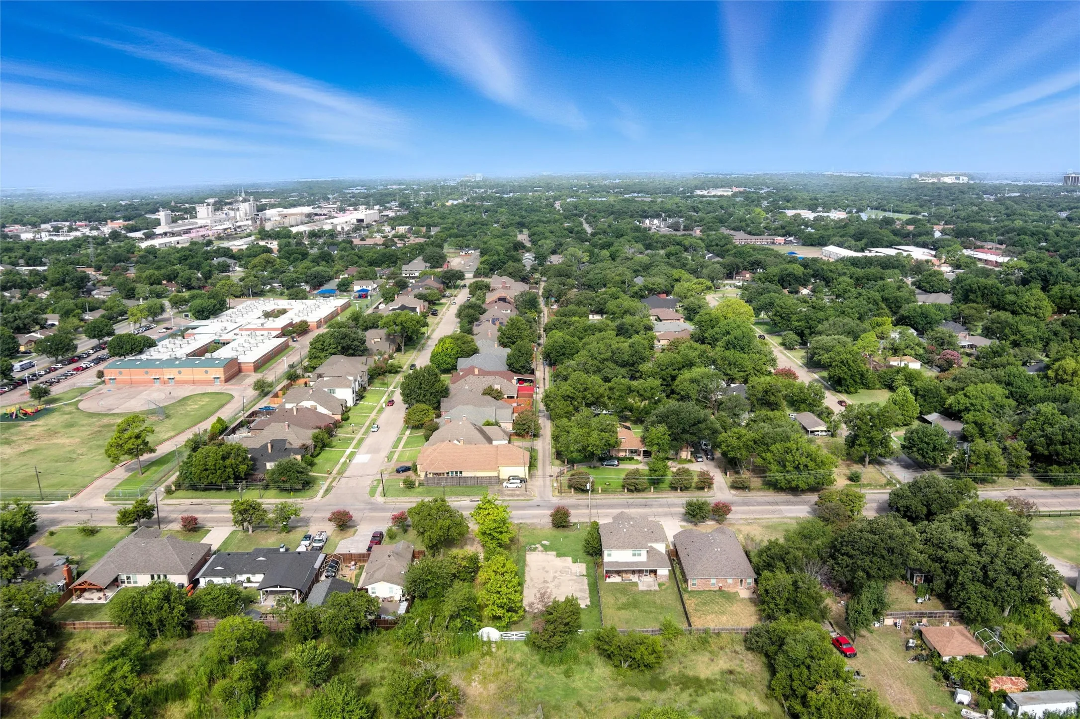 Aerial overview of property's location with nearby suburban area