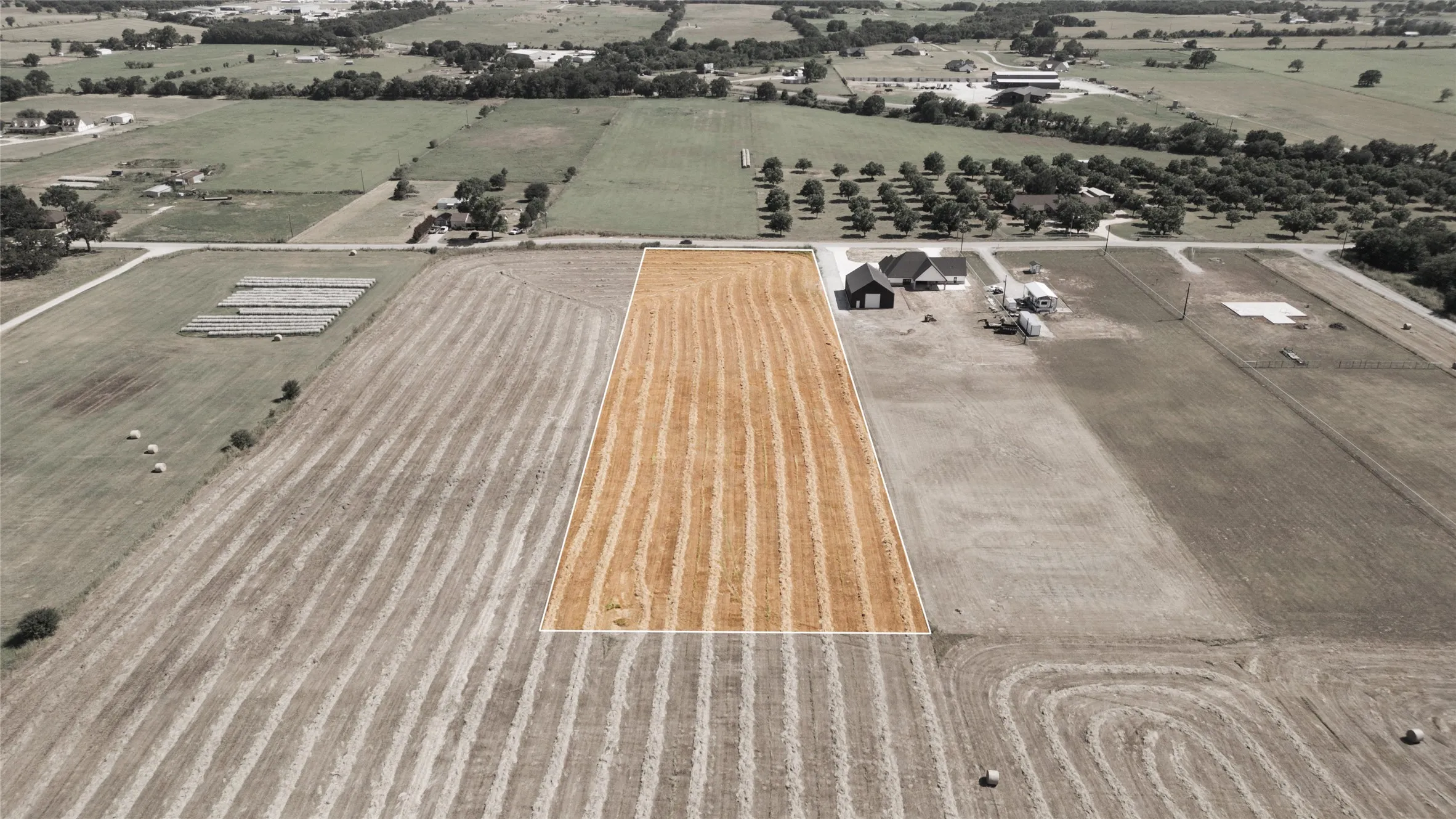 Aerial overview of property's location featuring rural landscape and abundant farmland