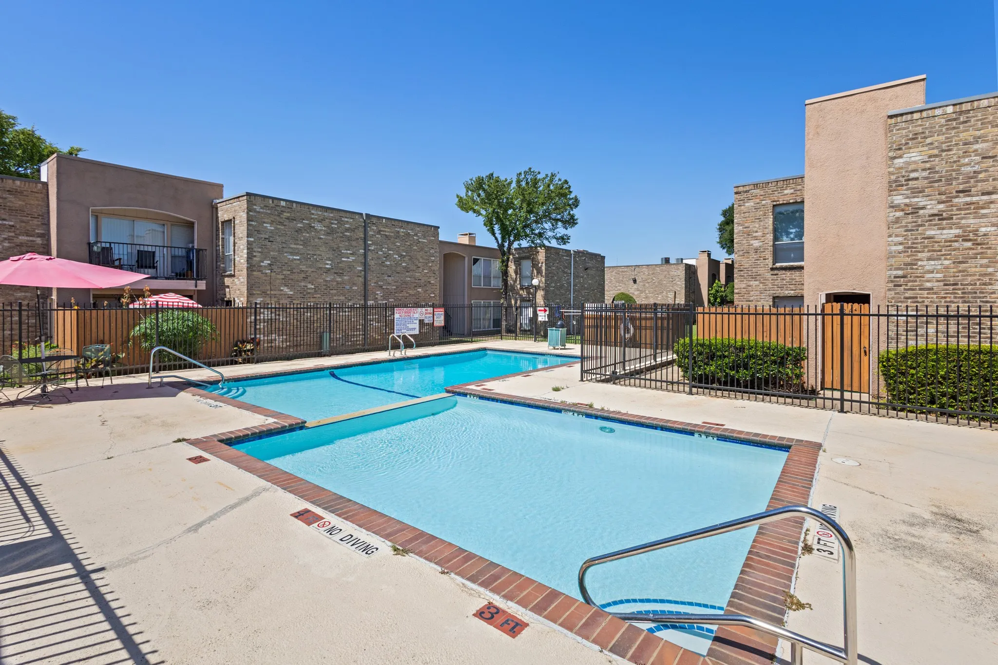 Community pool featuring a patio area