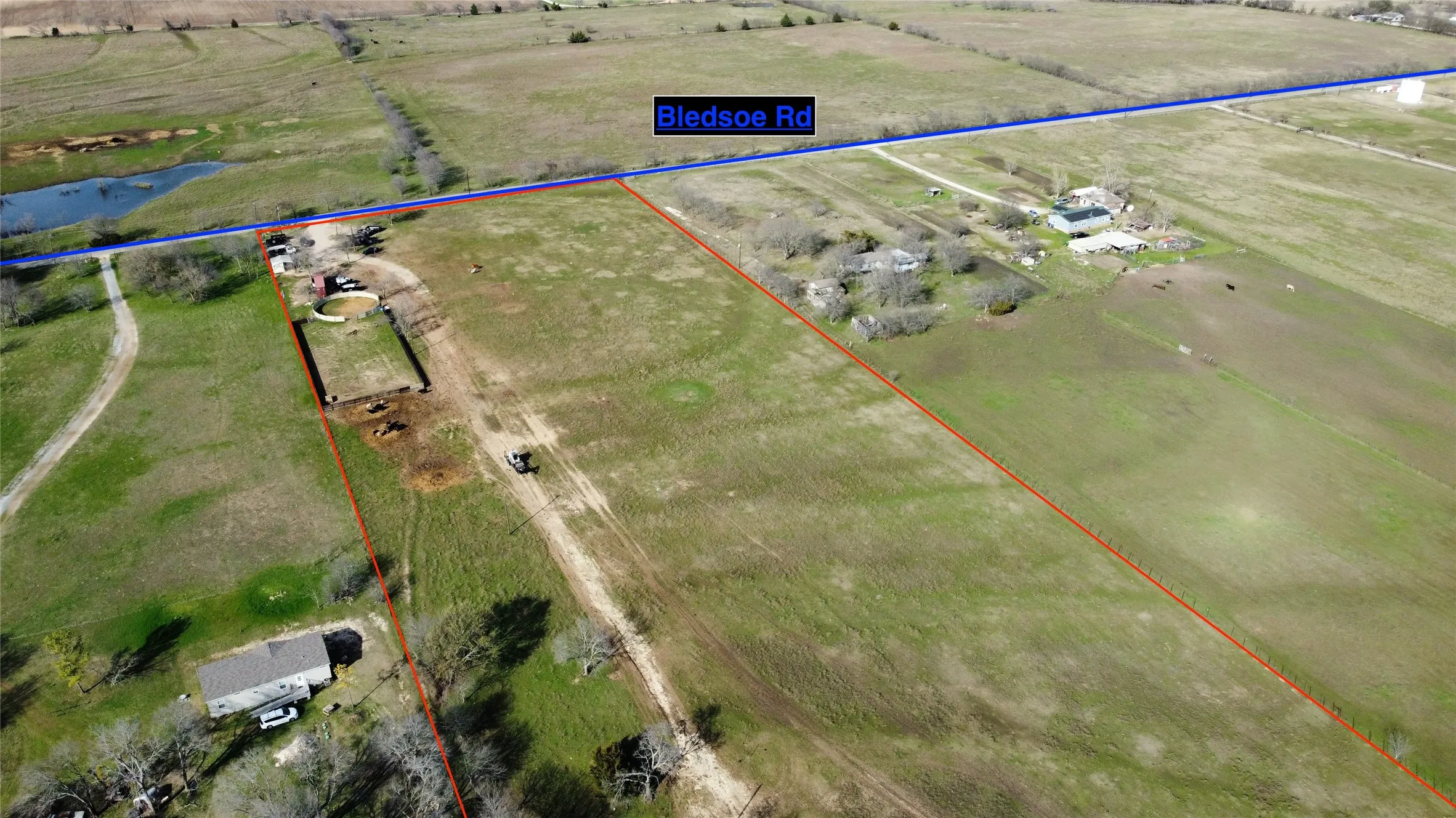 View of rural area with property boundaries highlighted and a nearby body of water
