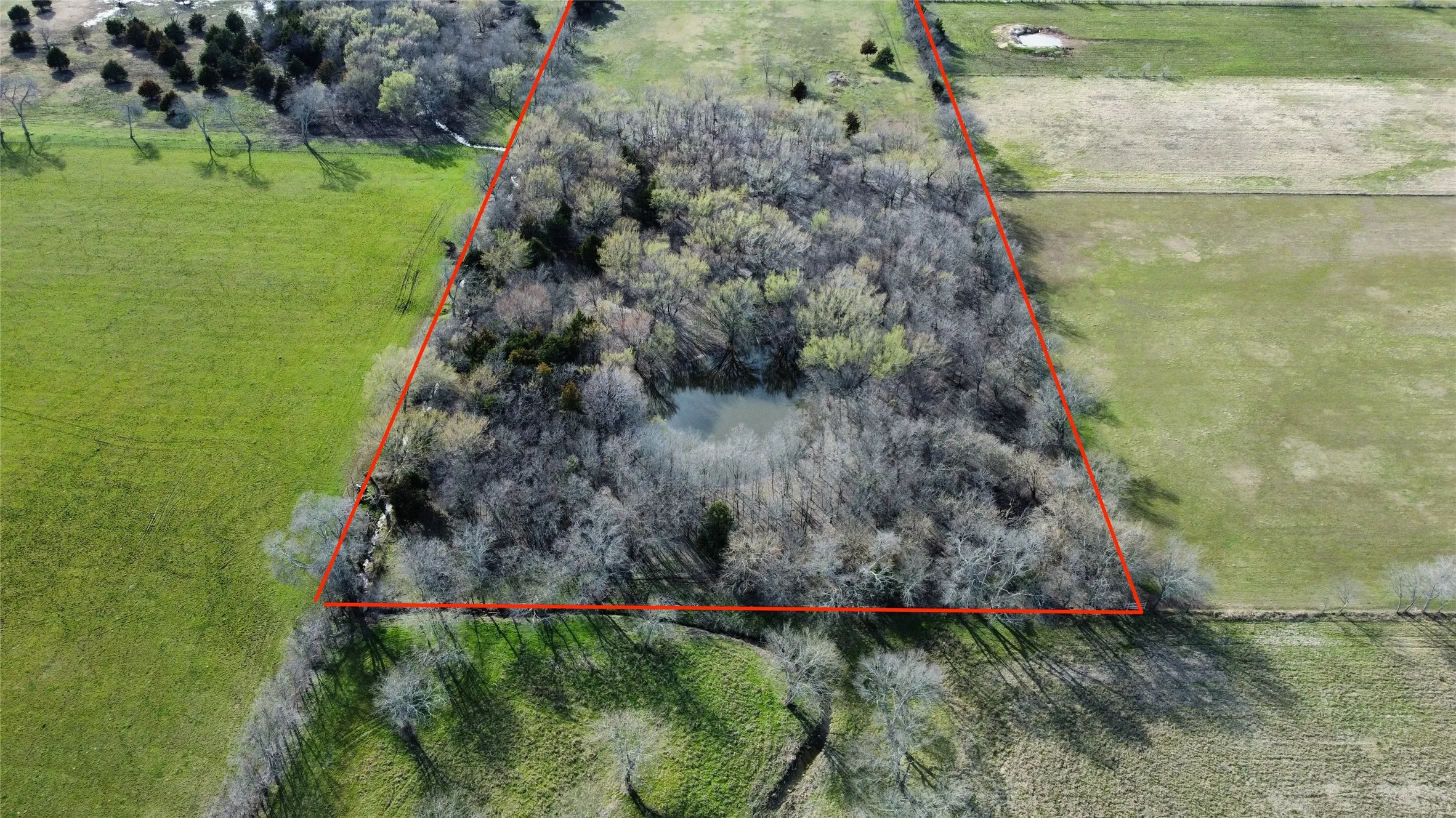 Overview of rural landscape featuring property parcel outlined