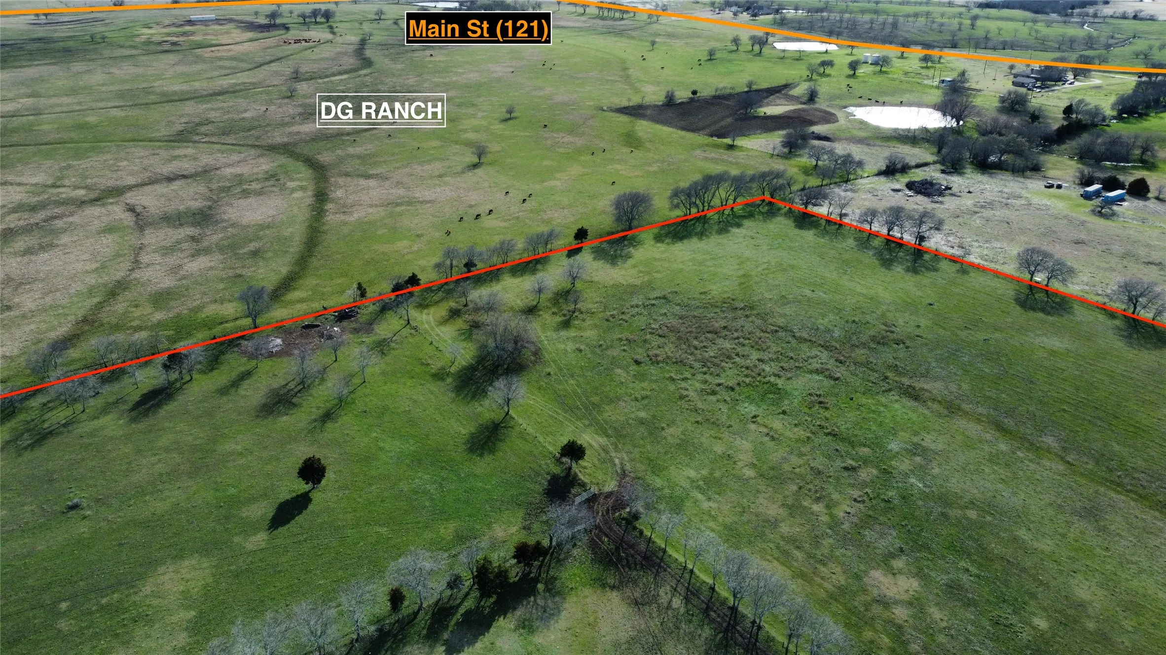 Aerial view of sparsely populated area featuring property boundaries highlighted