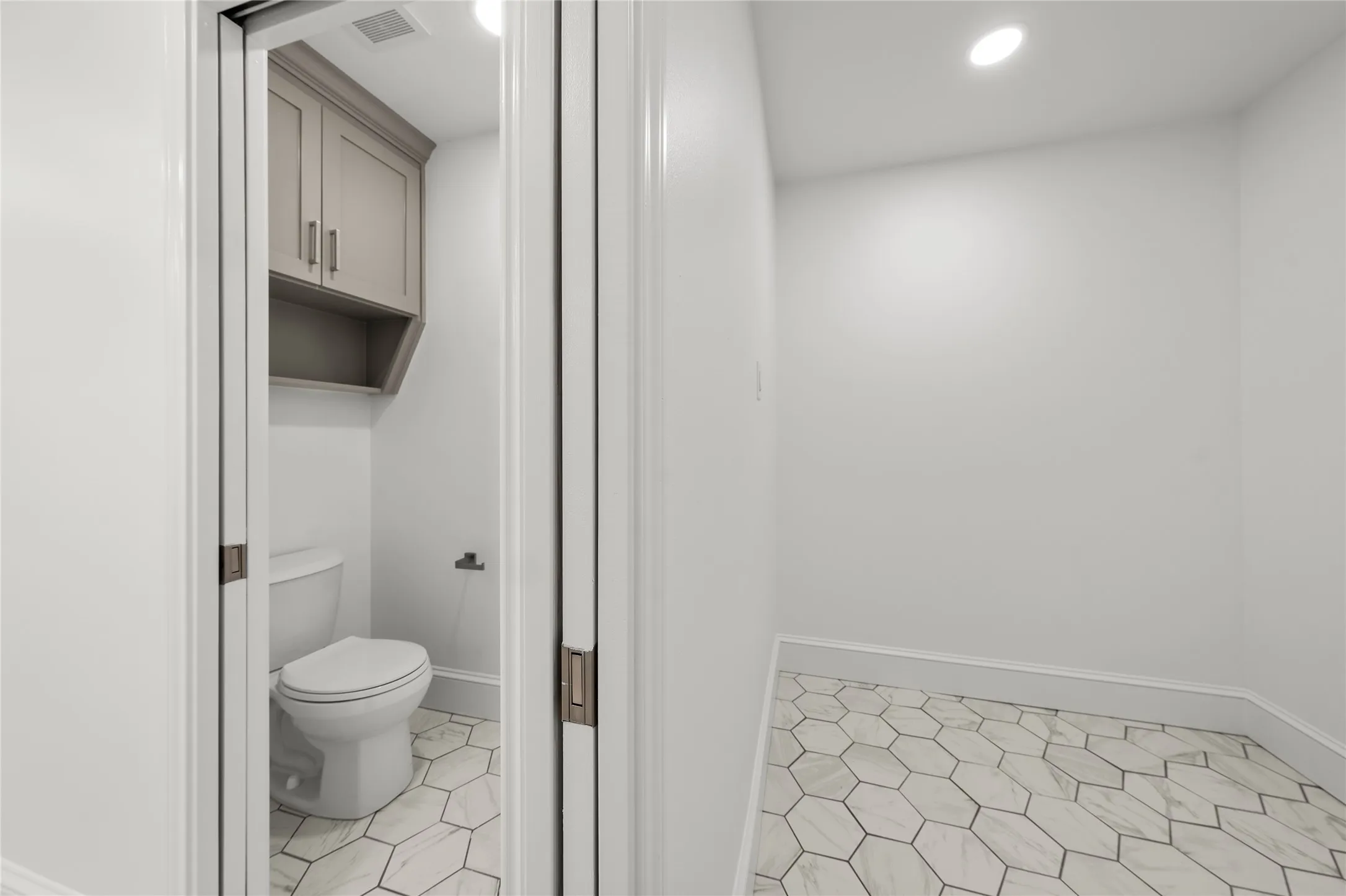 Bathroom with toilet and recessed lighting