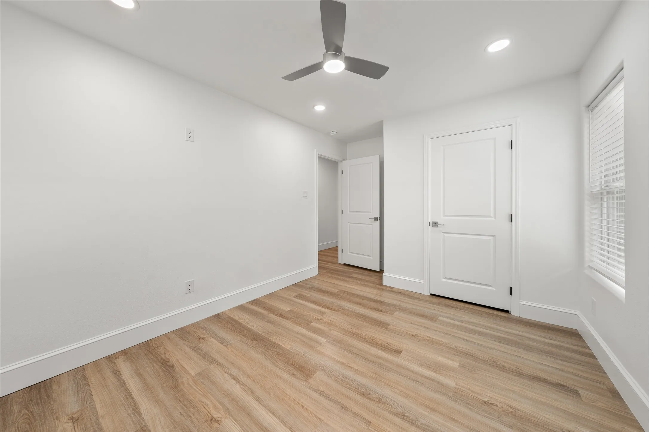 Unfurnished bedroom featuring light wood-style floors, recessed lighting, and ceiling fan