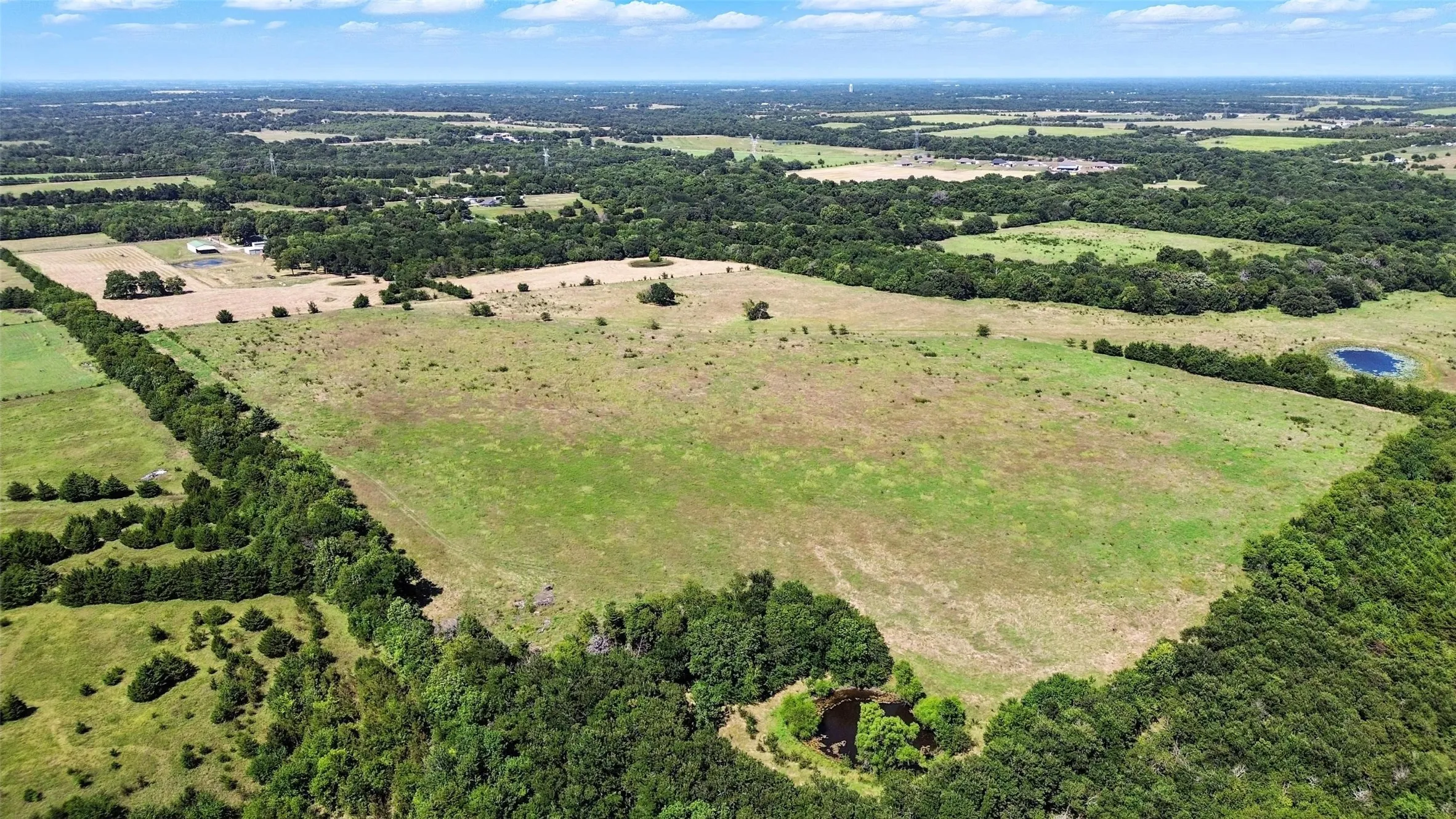 Aerial overview of property's location with rural landscape