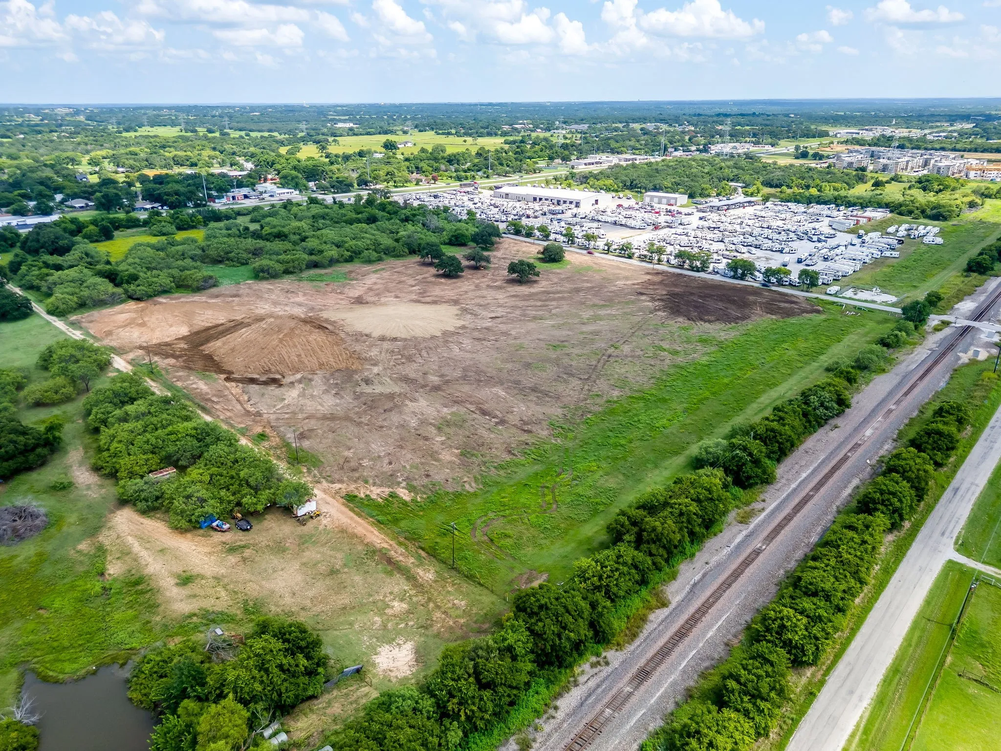 View of property location with a tree filled landscape