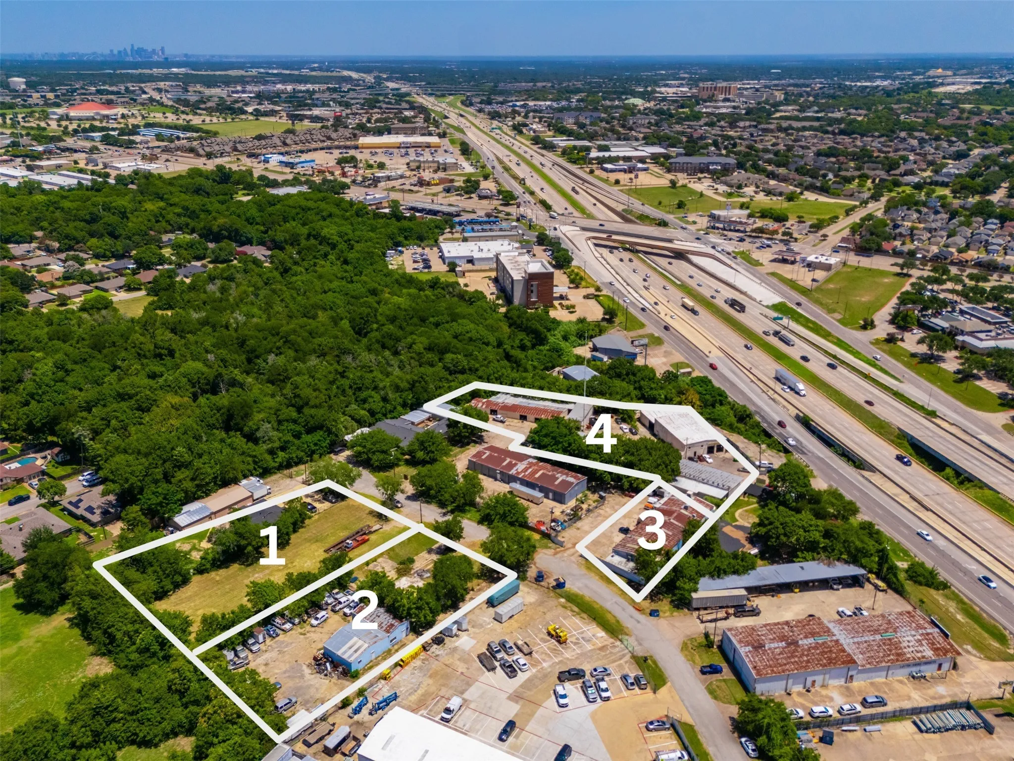 Aerial depiction of multiple property parcels (1, 2, 3, 4) with varying land uses