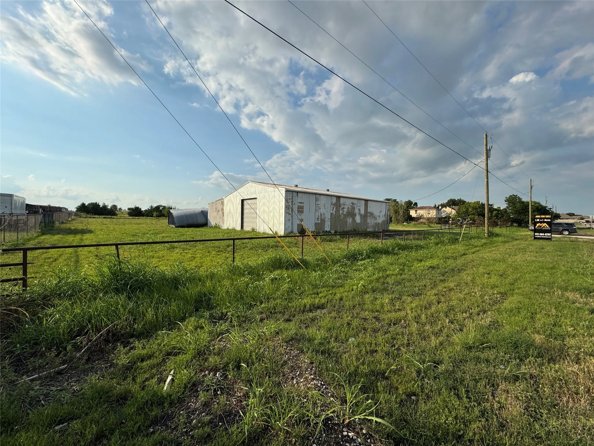 View of yard with an outbuilding, an outdoor structure, and a rural view