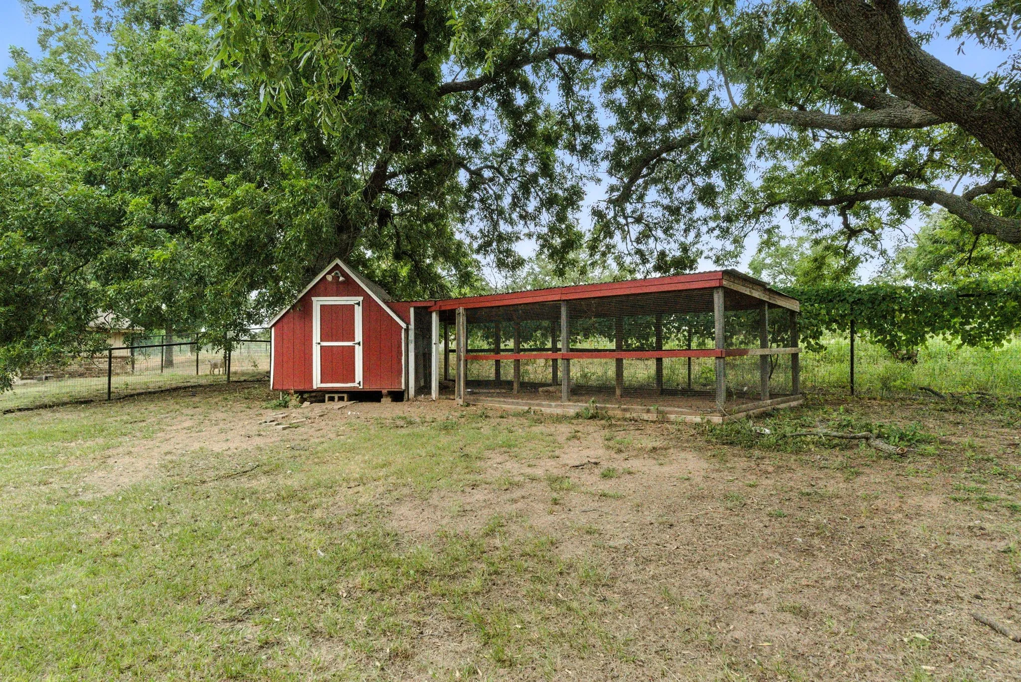 View of yard with exterior structure and an outbuilding