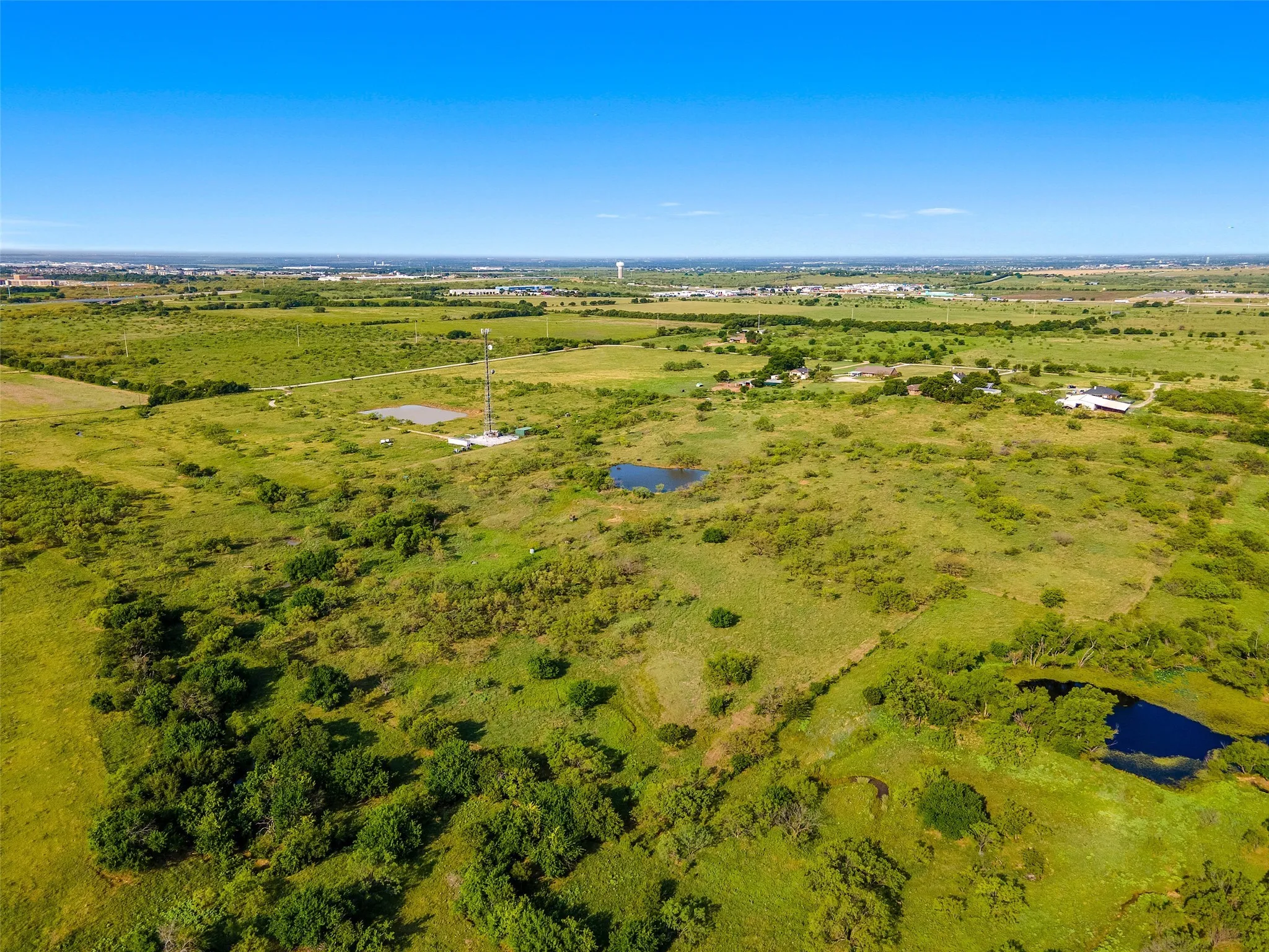 Overview of rural landscape with a nearby body of water