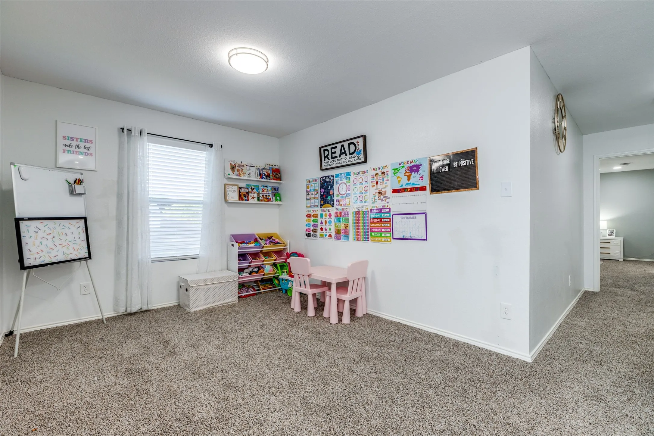 Game room with carpet flooring