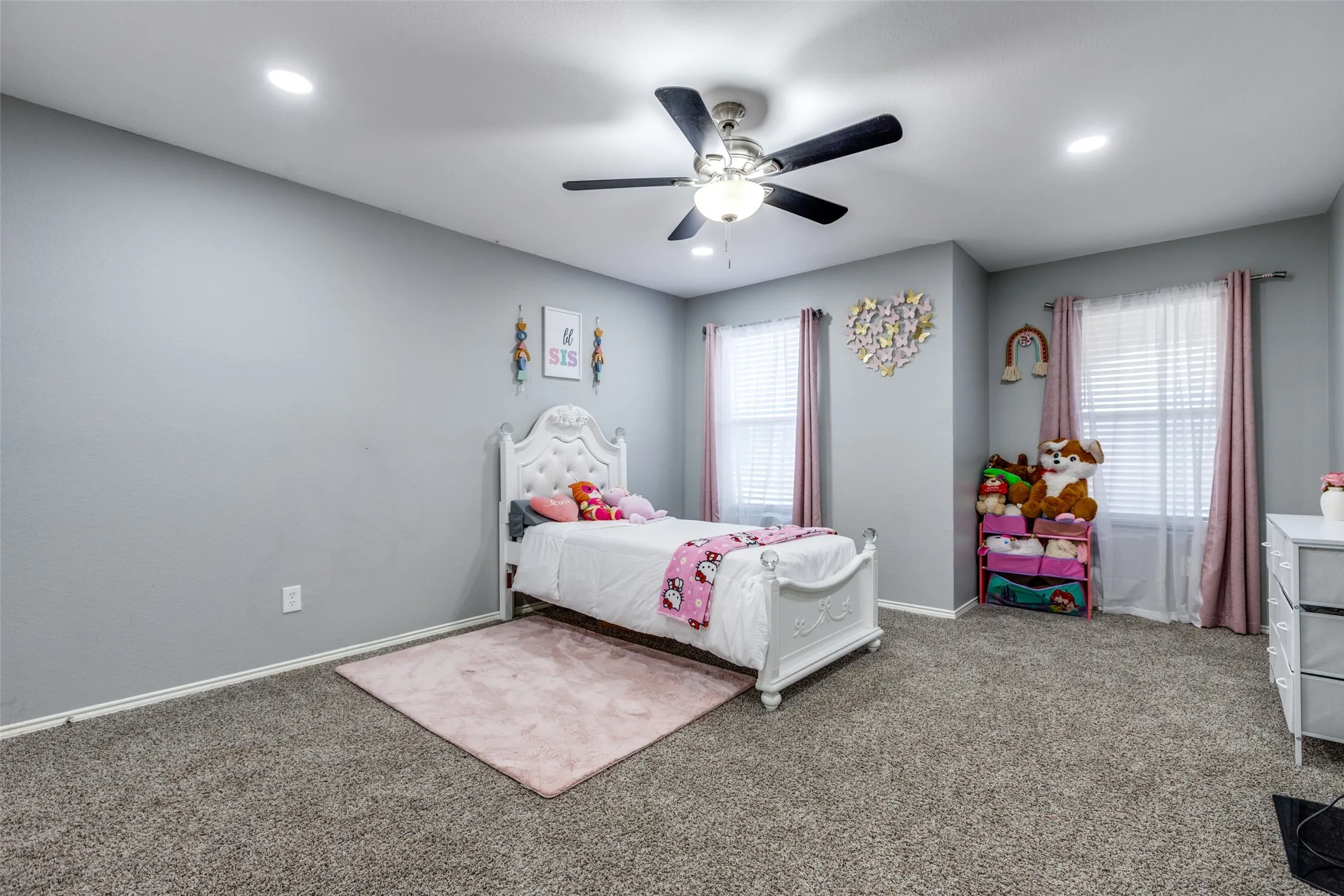 Carpeted bedroom featuring recessed lighting and ceiling fan