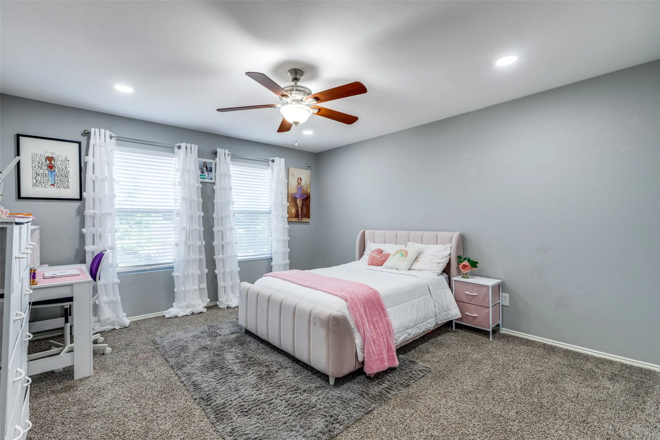 Carpeted bedroom featuring recessed lighting and a ceiling fan