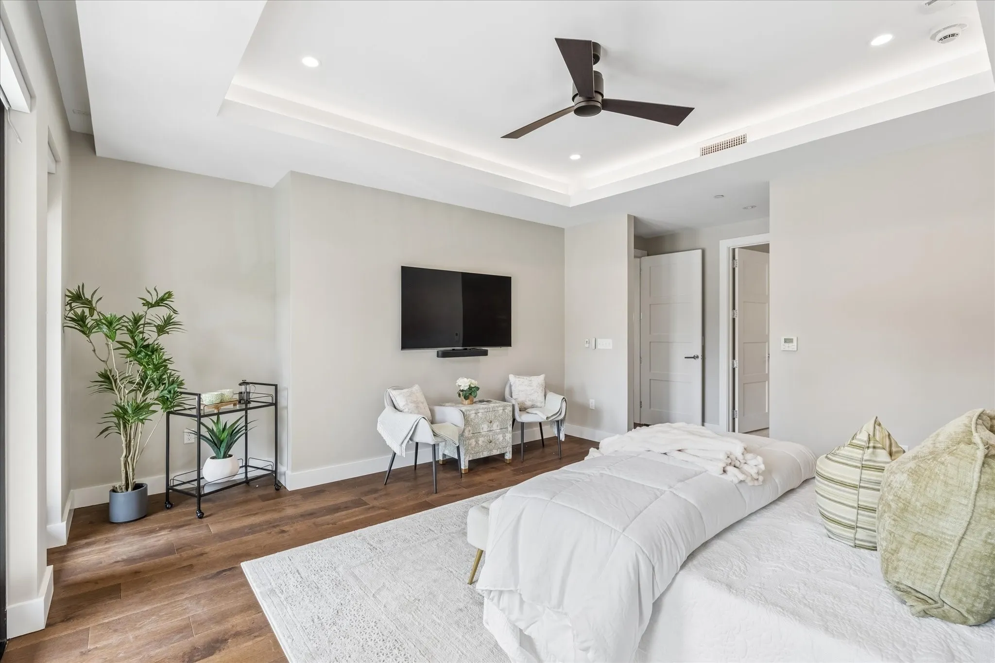 Mounted Flat Screen TV and Soundbar are included and will stay.