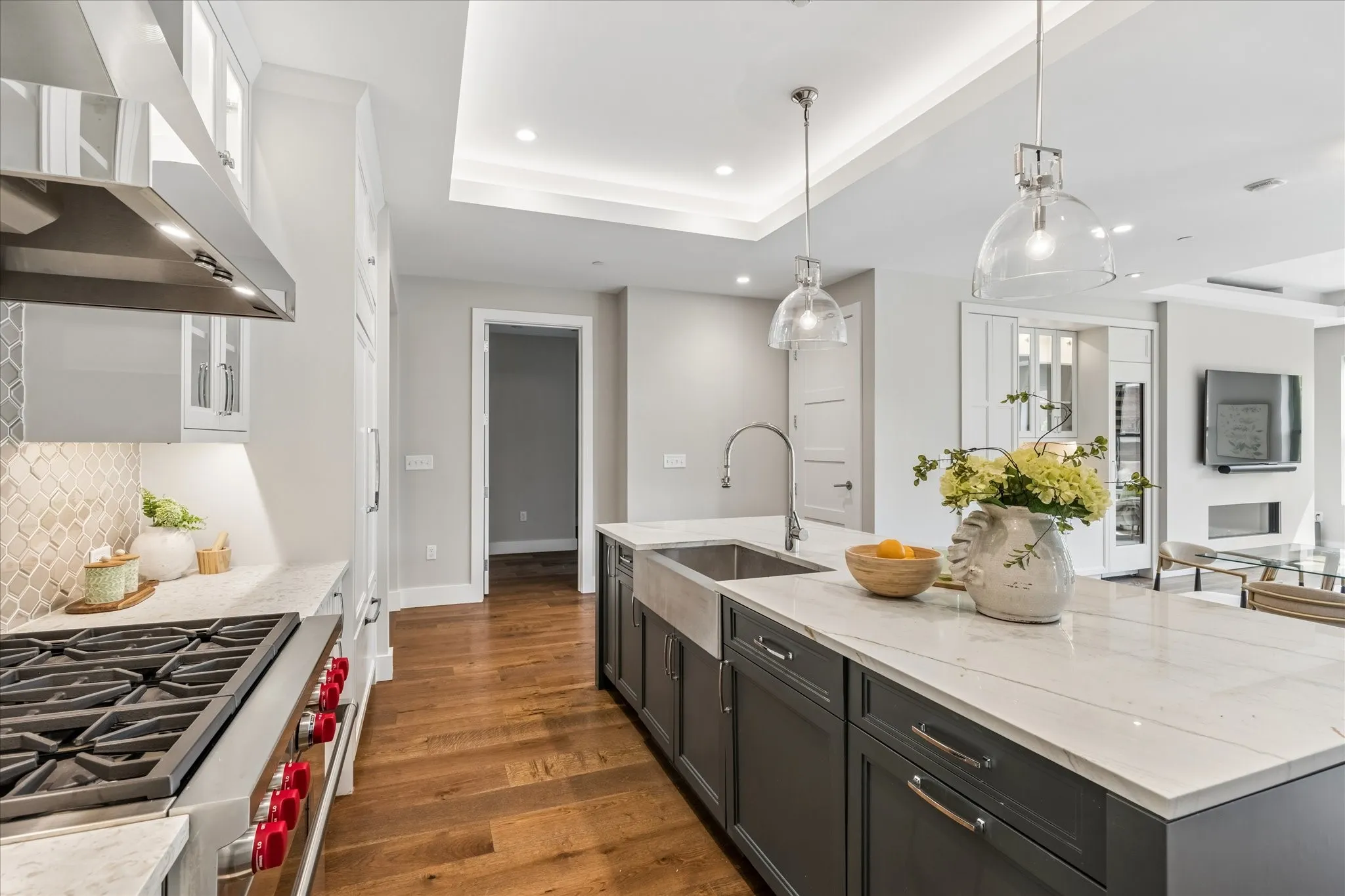 Center Island with Quartzite Island Countertop, Nugget Ice Maker, and European White Oak Flooring