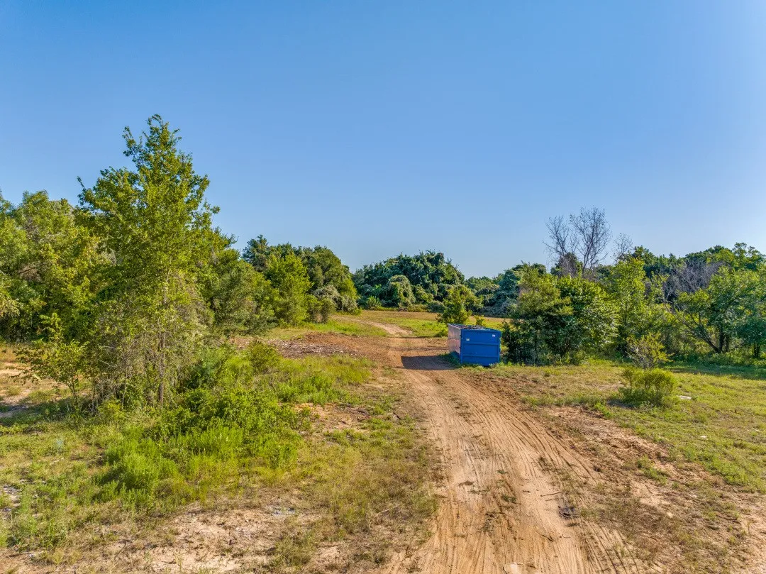 View of dirt / gravel road featuring a rural view