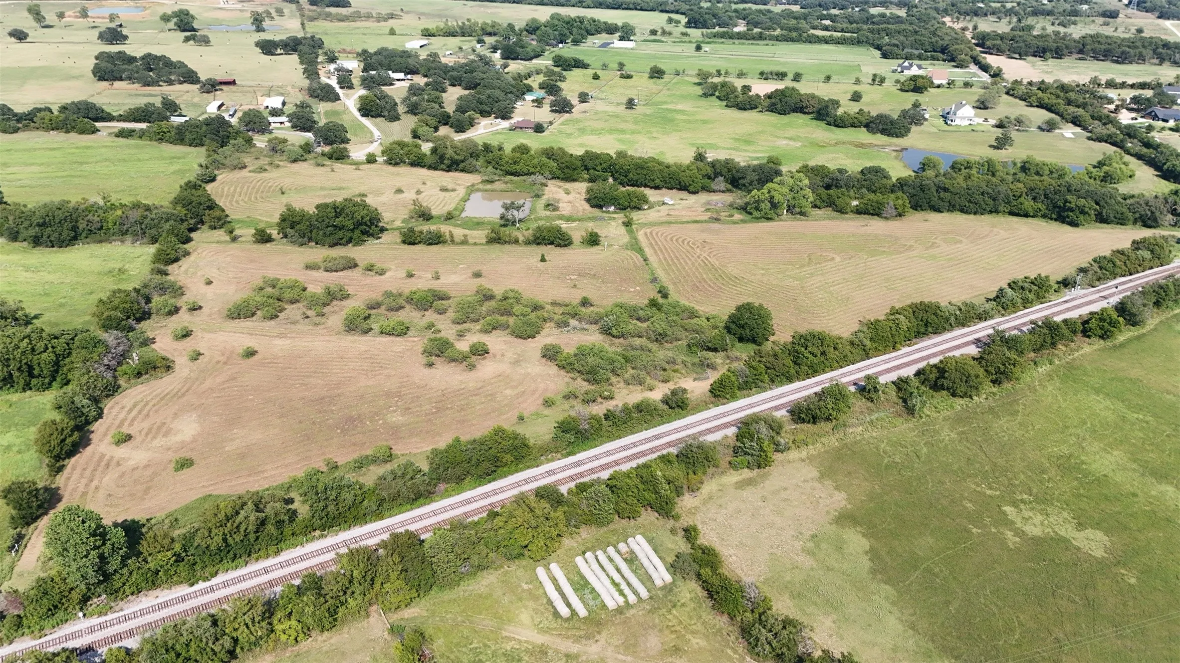 Aerial view of sparsely populated area with extensive farmland