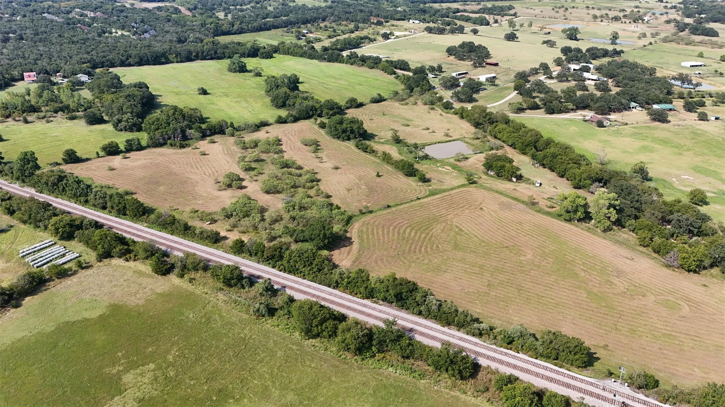 Aerial view of sparsely populated area featuring farmland