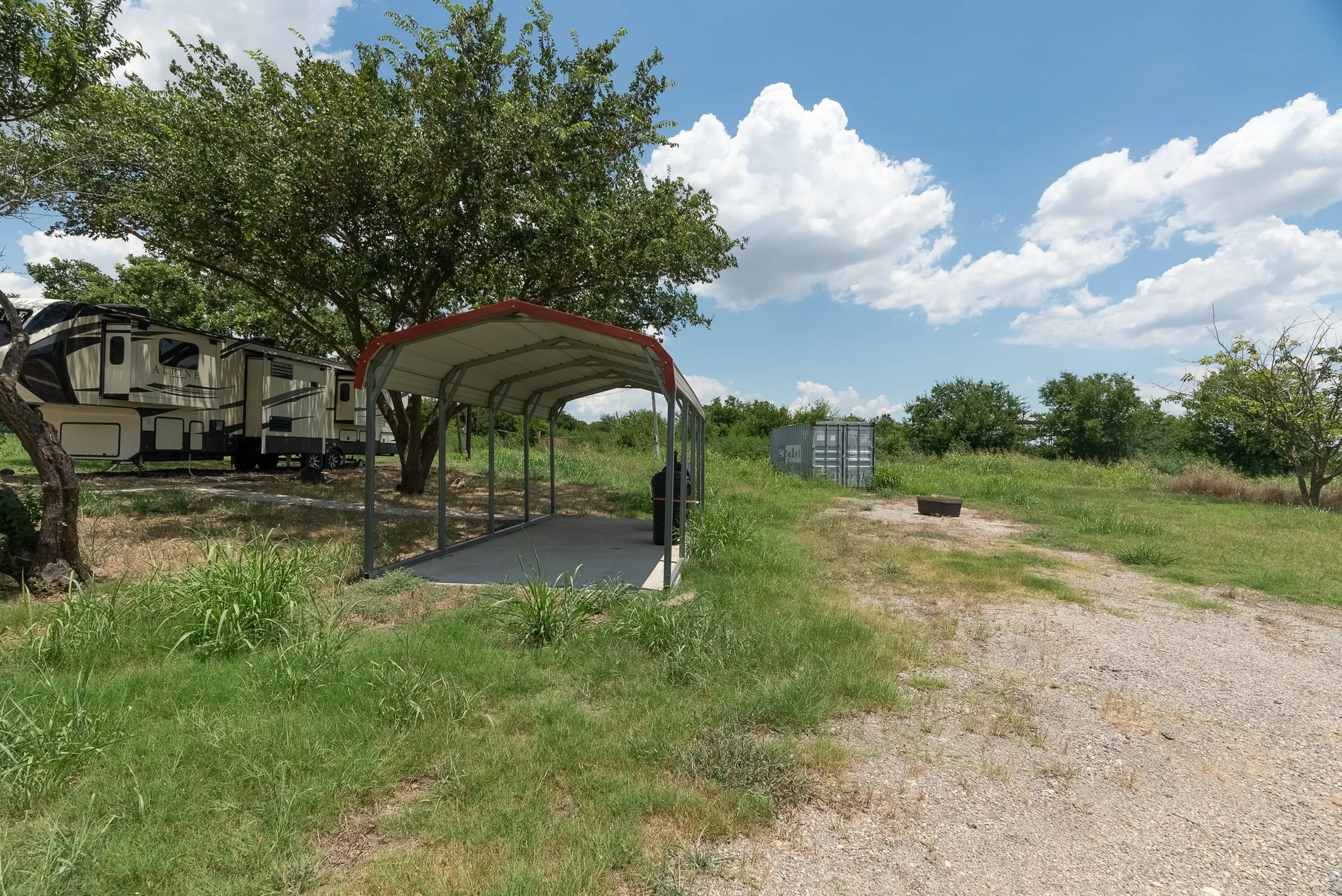 View of yard with a carport