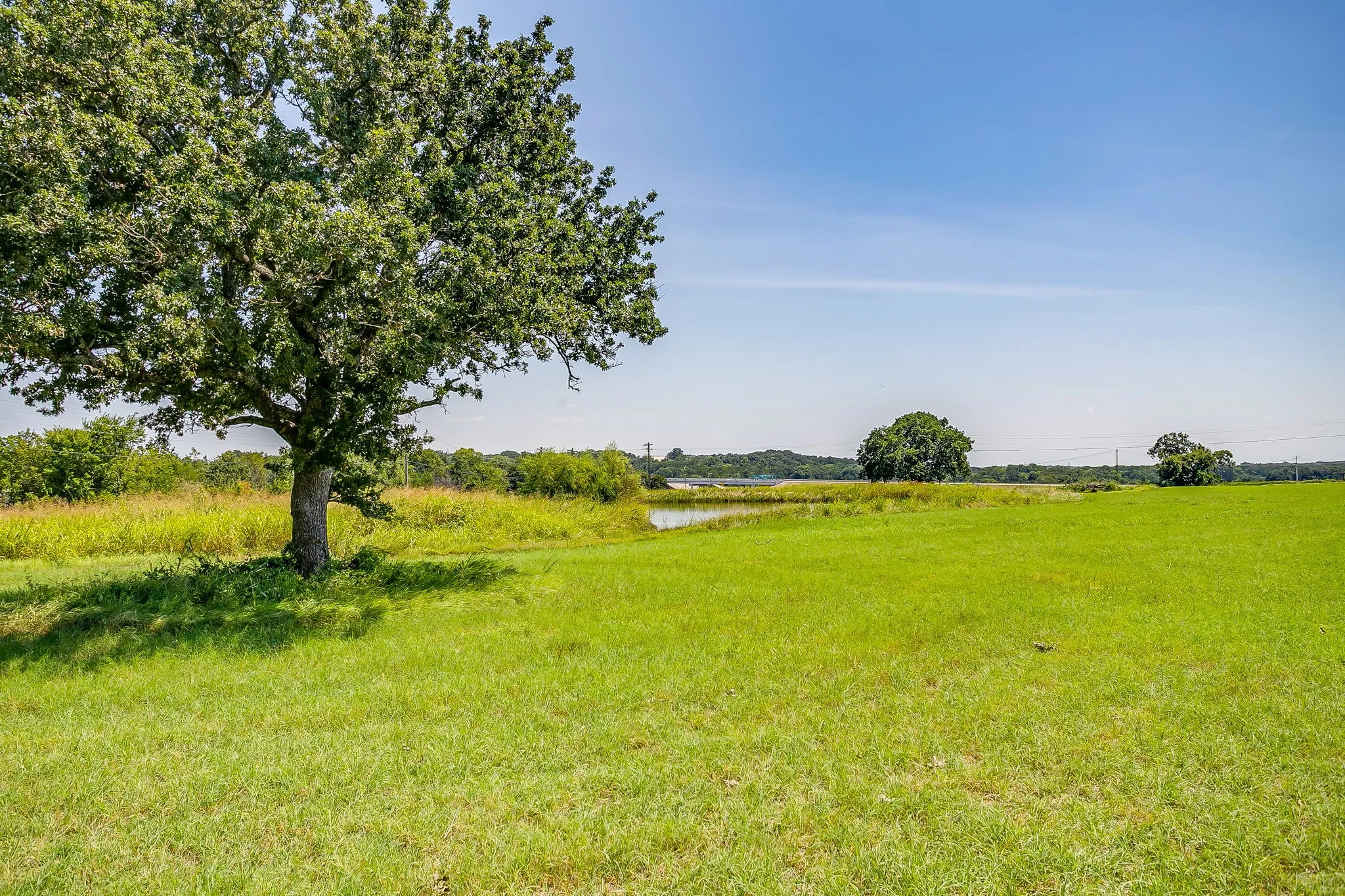View of yard featuring a water view and a view of countryside