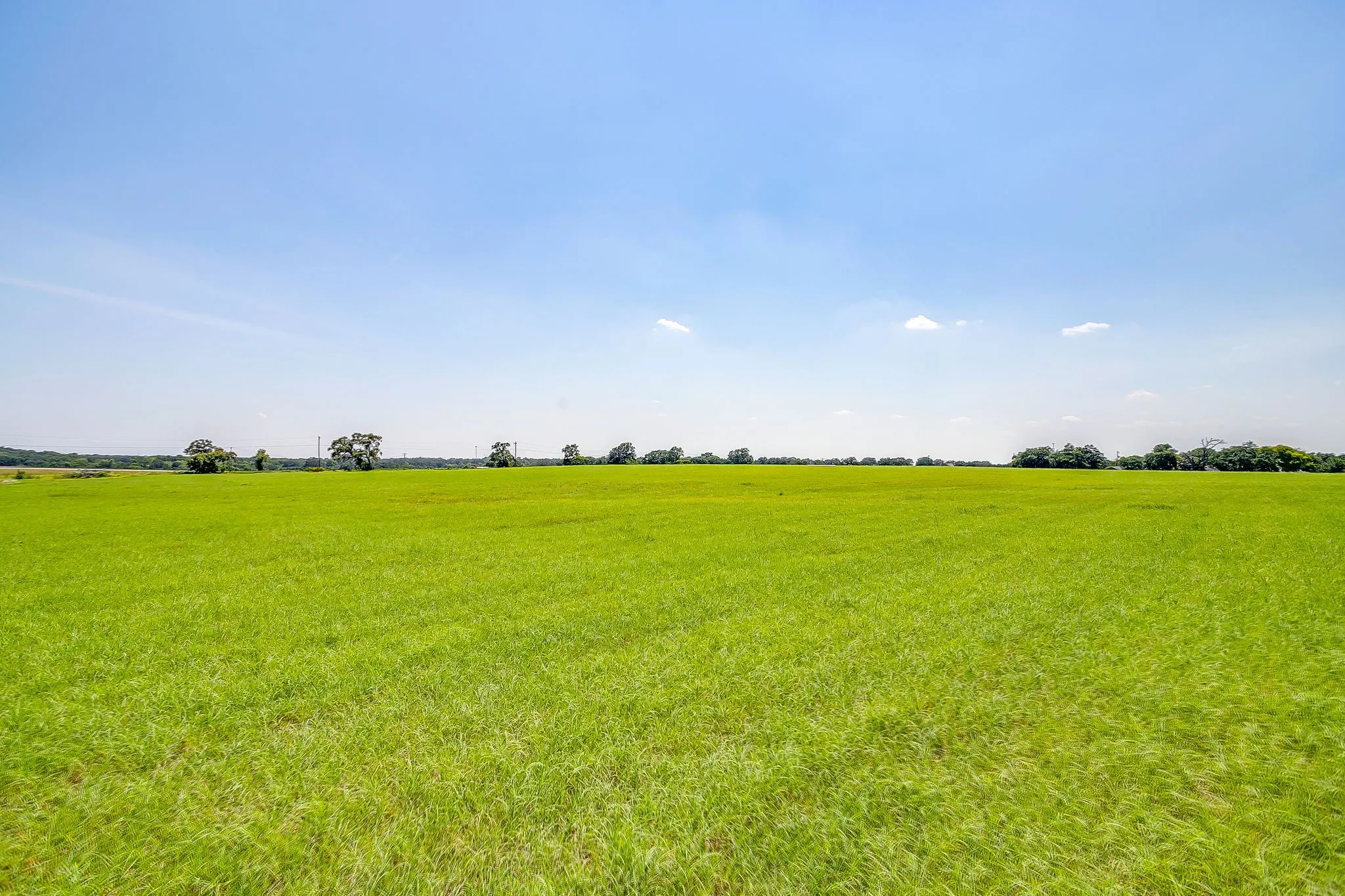 View of grassy yard with a view of countryside