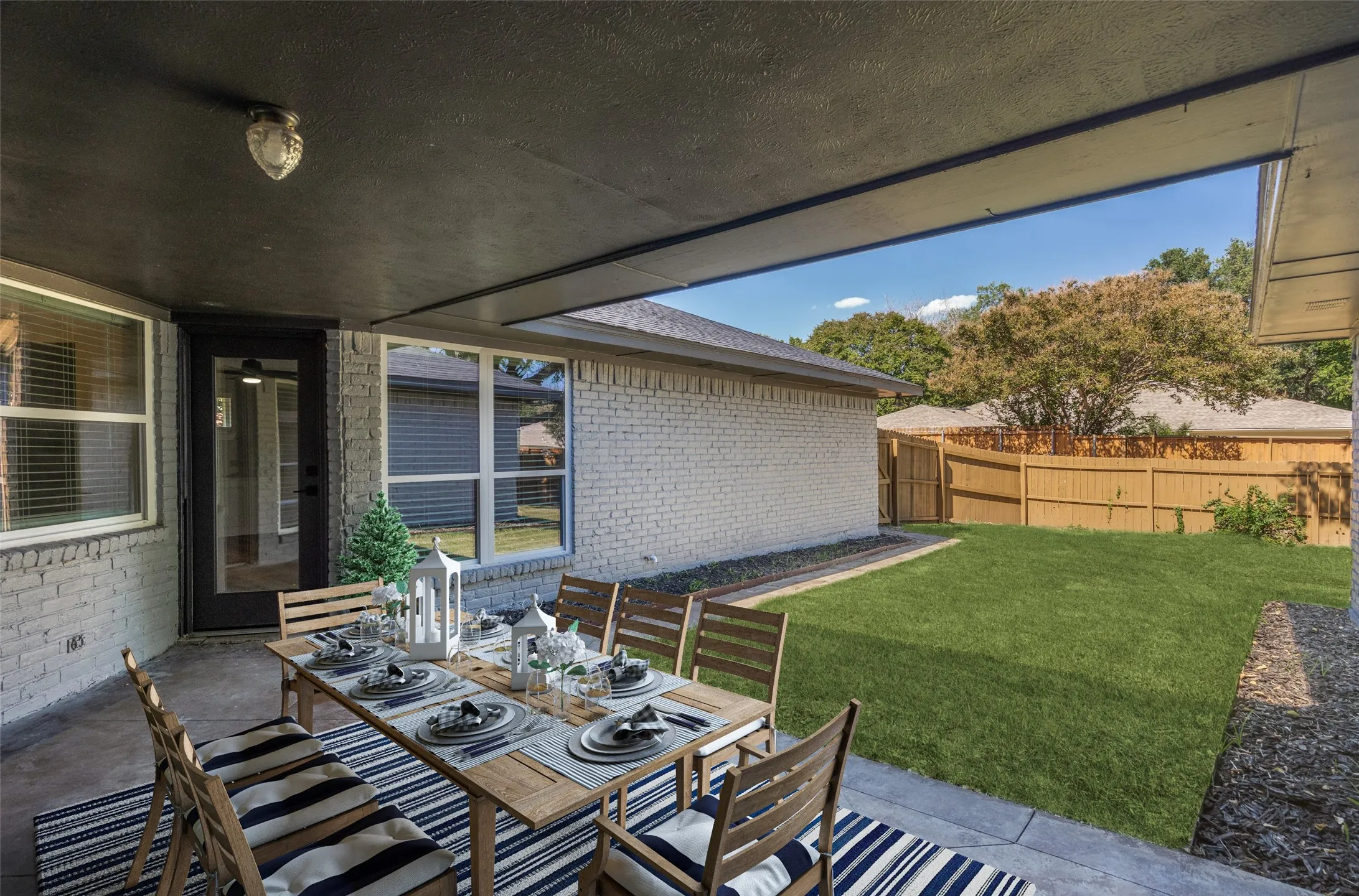 View of patio with outdoor dining area