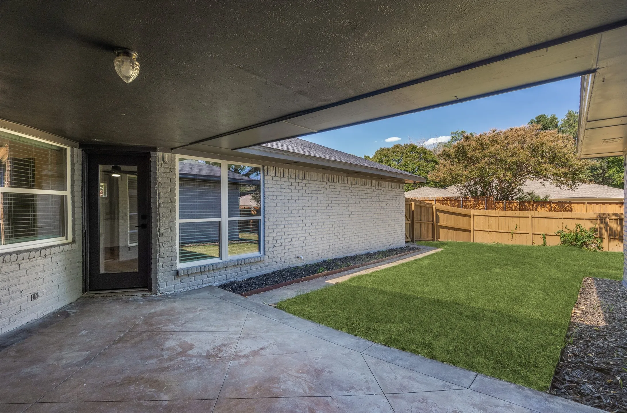 View of yard with a patio area
