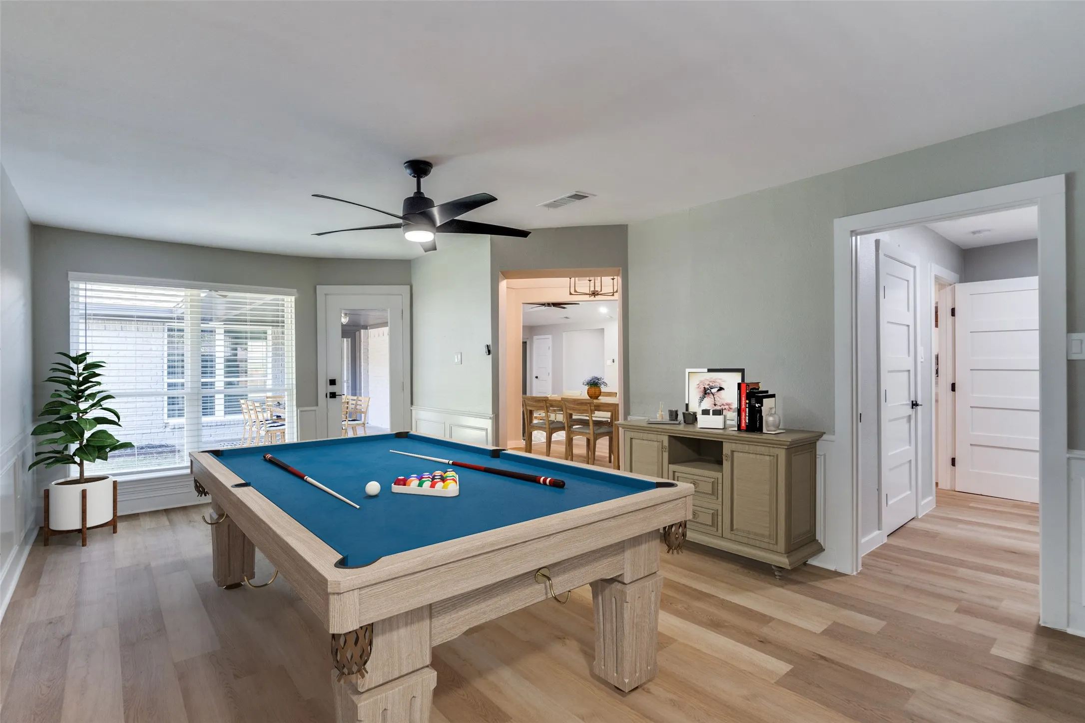 Recreation room featuring pool table, ceiling fan, and light wood finished floors