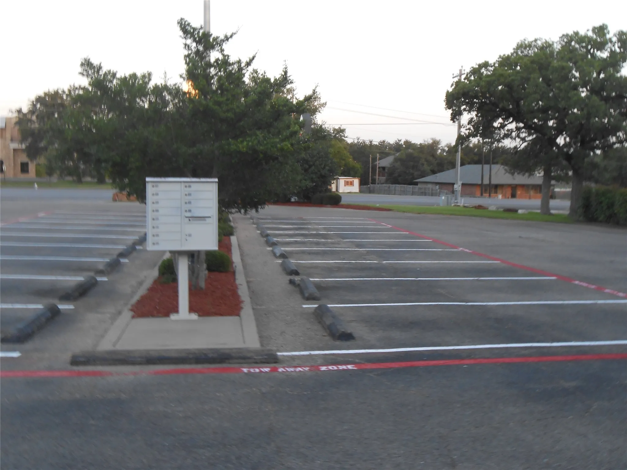 Uncovered parking lot with mail area
