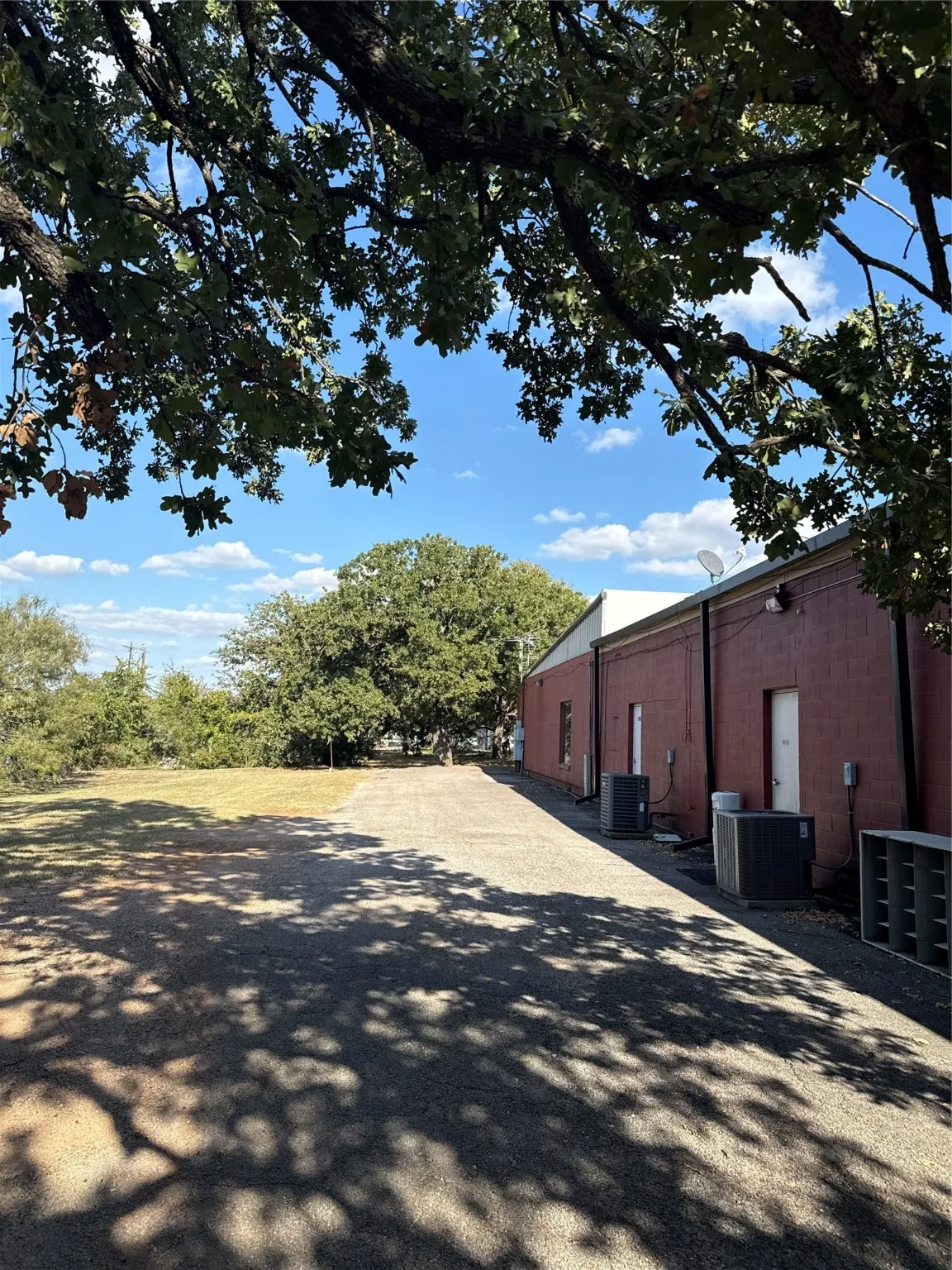 View of side of property featuring a central AC unit