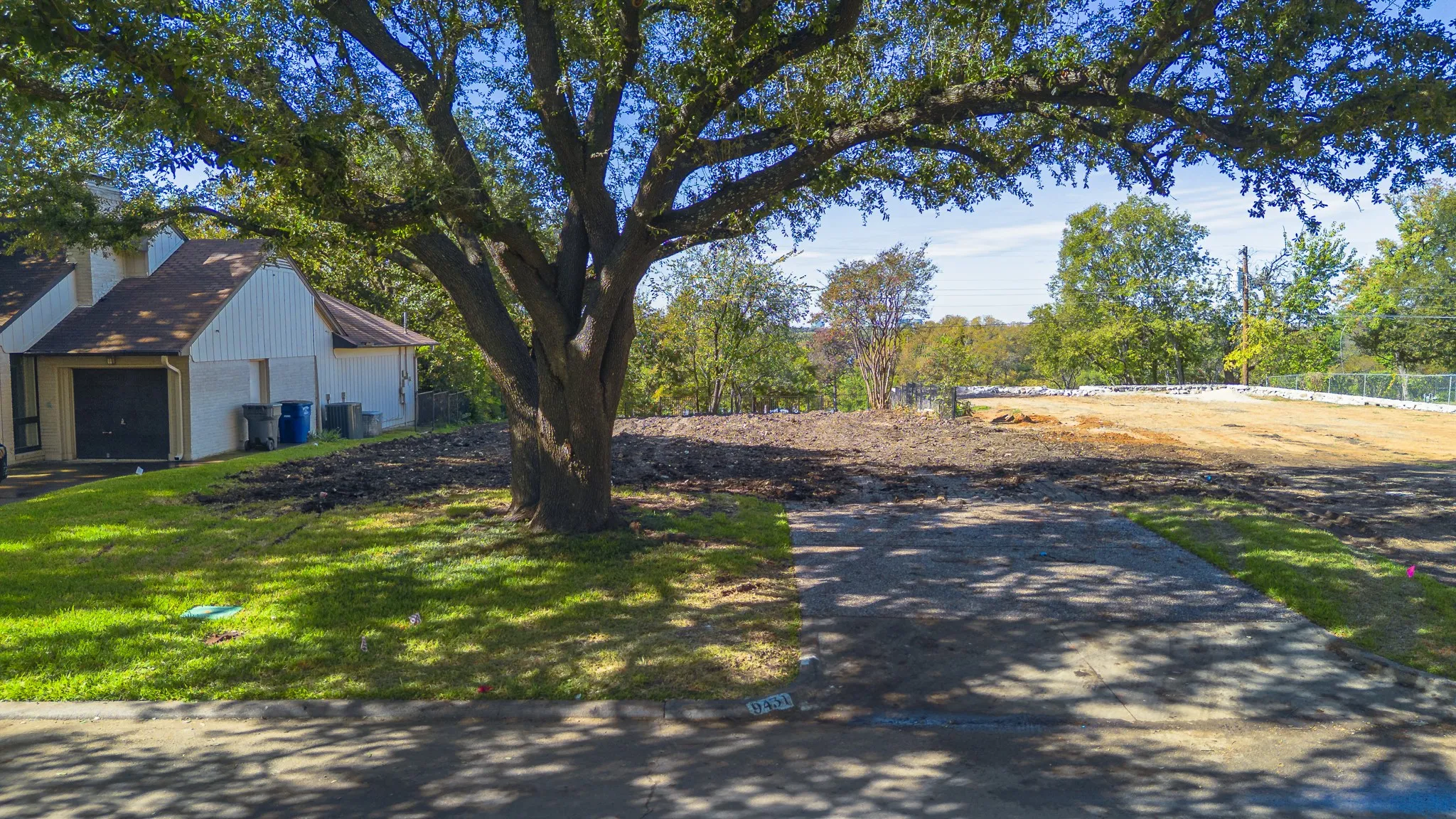 Mature oaks shade this quiet stretch of Waterview Road