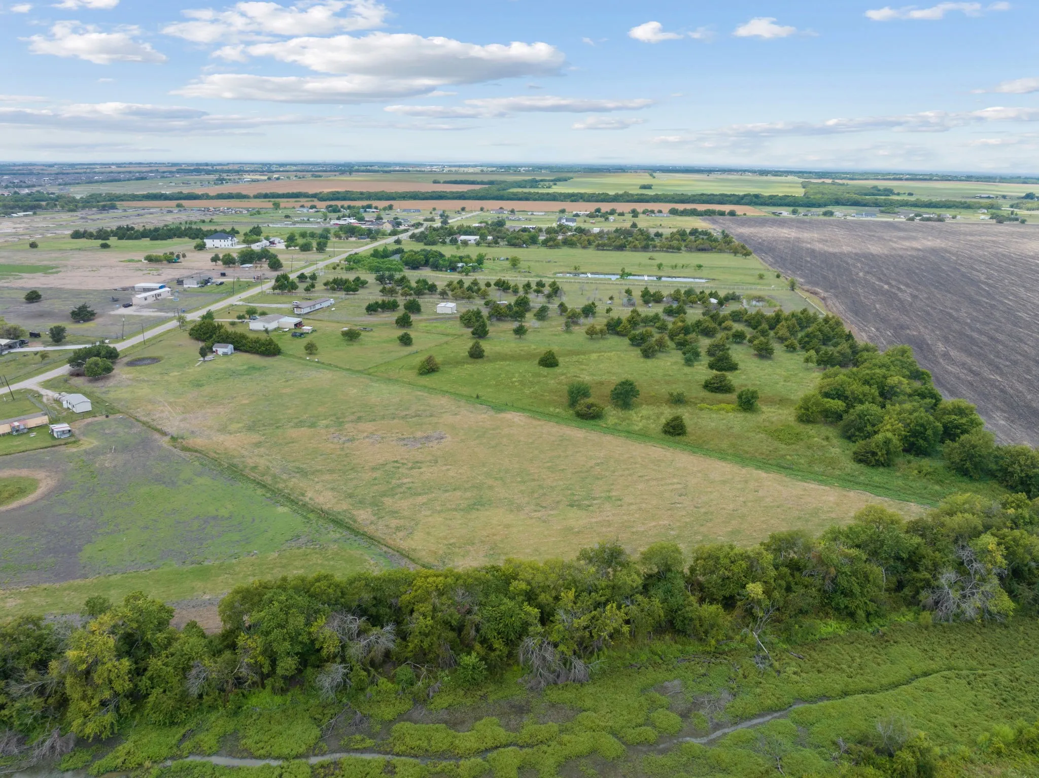 Aerial view of property's location with rural landscape
