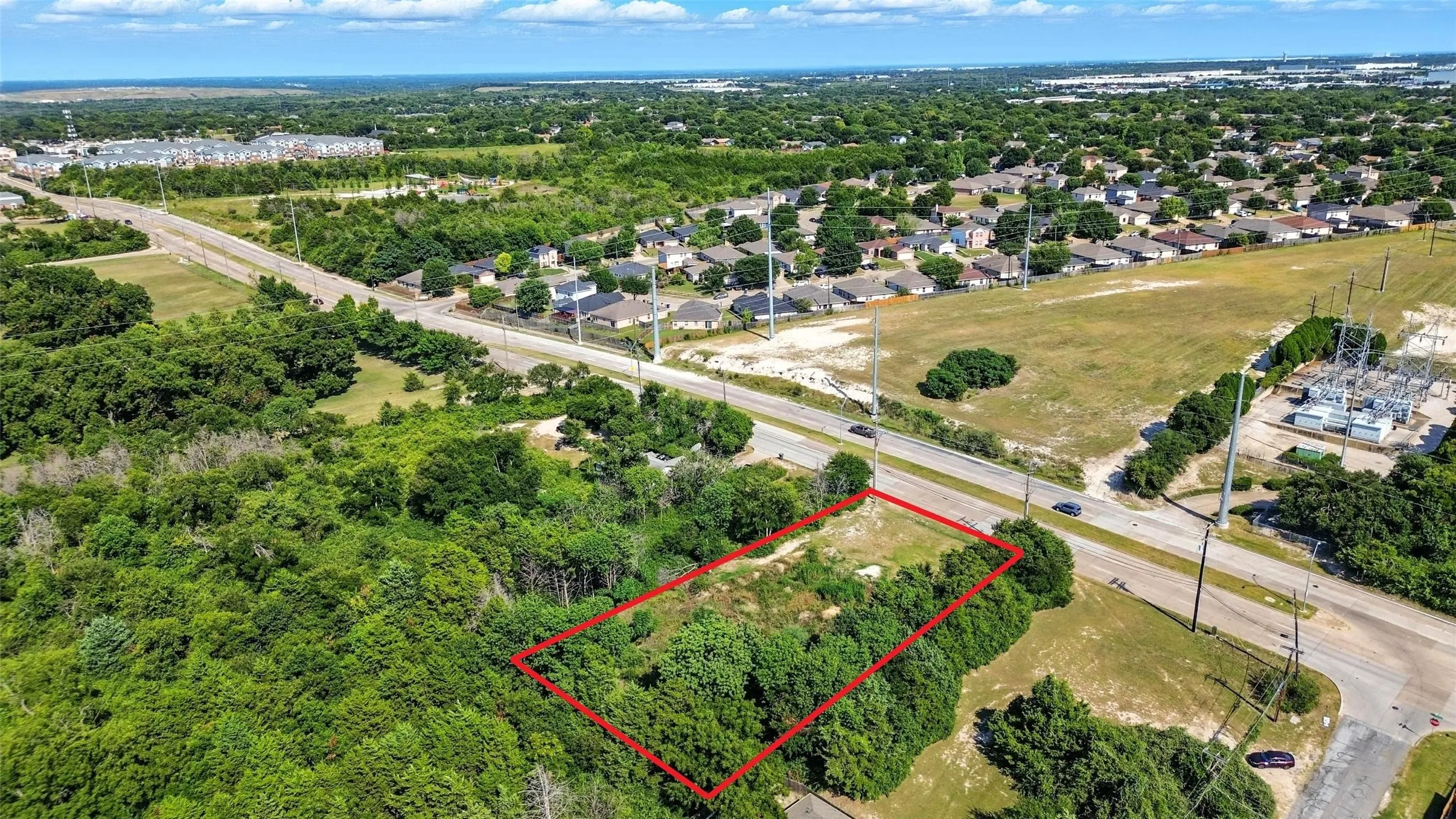 Aerial perspective of suburban area with property boundaries highlighted