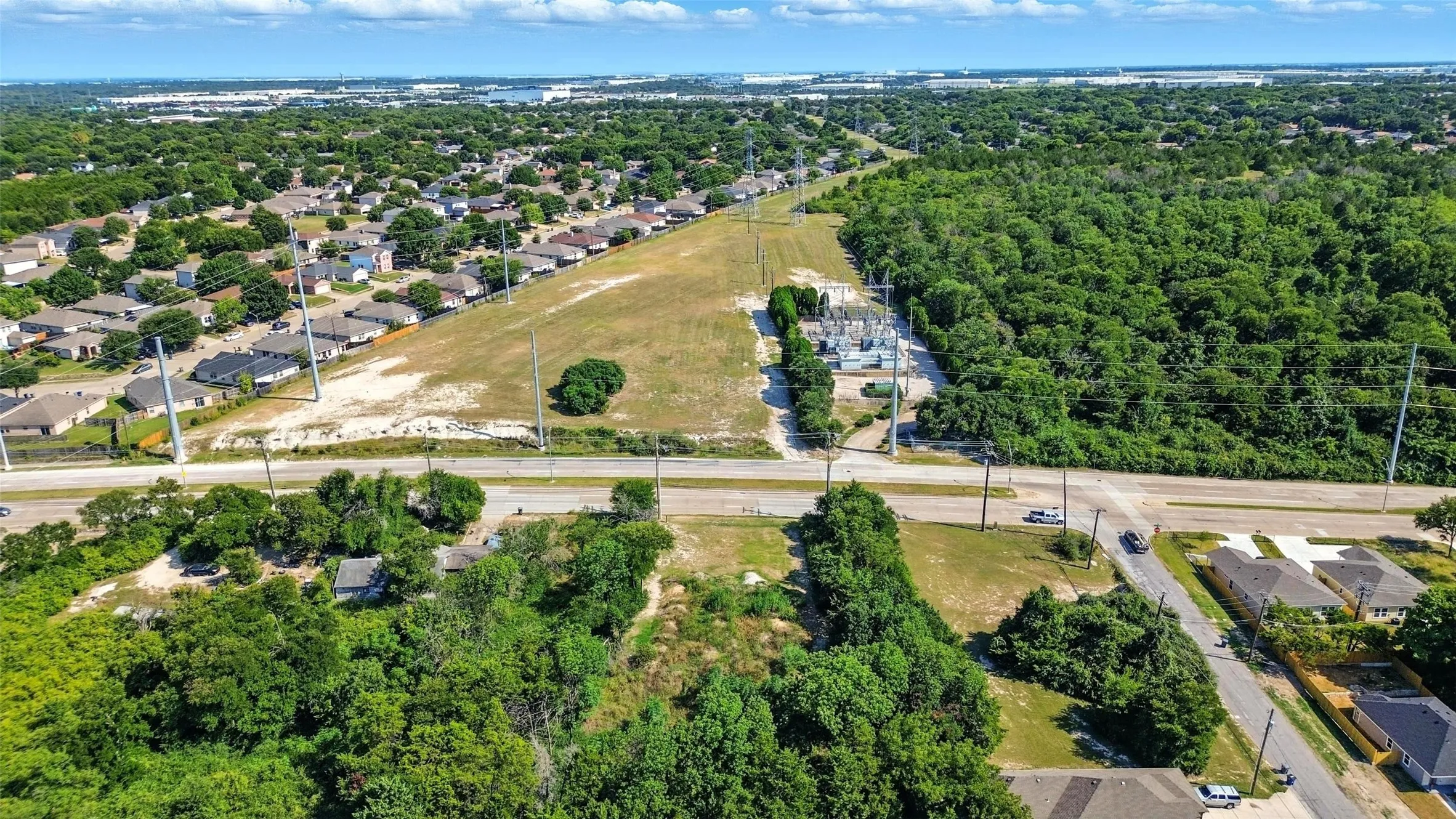 Aerial overview of property's location with nearby suburban area